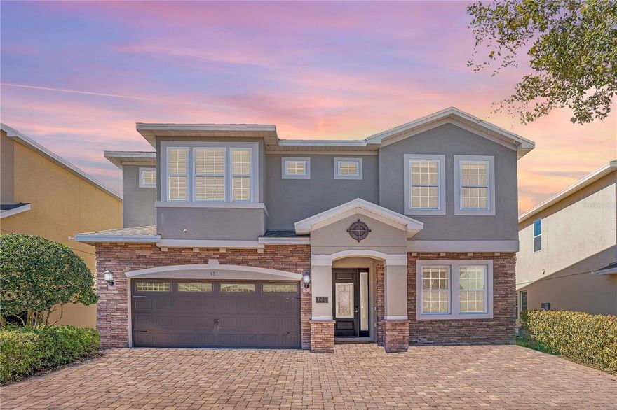 DESIGNED TO IMPRESS. POSITIONED TO PERFORM.
Welcome to this exceptional 10-bedroom, 10-bath luxury retreat in the highly sought-after Encore at Reunion - just minutes from Orlando’s world-renowned theme parks and projected to generate $120,000 in annual income.
Sold FULLY FURNISHED and completely TURNKEY, this 4,730 sq ft residence is crafted for elevated group travel and consistent rental demand. Featuring 9 private ENSUITE bedrooms, including FOUR PRIMARY SUITES (two downstairs and two upstairs), the layout delivers privacy, flexibility, and comfort at scale. Every closet includes custom built-in shelving, adding thoughtful organization throughout.
What truly sets this home apart is its IMMERSIVE “WORLD SHOWCASE INSPIRED - AROUND THE WORLD” design concept; each bedroom carefully curated to transport guests across iconic destinations. From the historic charm of Philadelphia to the timeless sophistication of London, the skyline energy of Manhattan, the Mickey Inspired Orlando suite, the bold glamour of Vegas, the icy enchantment of Arendelle, and the romance of Paris - every space is layered with custom murals, curated décor, and thoughtful design elements that create a stay guests remember long after checkout. This intentional theming enhances booking appeal, guest experience, and repeat revenue.
The OPEN-CONCEPT living space invites connection, flowing into a gourmet kitchen built for entertaining with granite counters, 42” shaker cabinetry, dual stainless steel refrigerators, dual dishwashers, and a dedicated coffee bar. Upstairs and downstairs laundry suites plus two Owner’s Closets provide seamless management and owner convenience.
Entertainment is effortless. The interactive STAR WARS INSPIRED GAME ROOM features ping pong, air hockey, and foosball, while the private THEATER ROOM sets the stage for cozy movie nights after a day at the parks. A dedicated WORK-FROM-HOME-STATION accommodates extended stays with ease.
Outside, your private resort oasis awaits, complete with a HEATED POOL AND SPA, expansive paver lanai, fenced tropical backyard, and a NEW high-rated insurance-compliant pool safety fence with self-closing, self-latching gate for added peace of mind.
Major value-enhancing upgrades include a NEW ROOF (2025), FRESH INTERIOR PAINT (2026), two newer refrigerators (2024 & 2025), new upstairs washer (2024), tankless water heaters, and dual A/C systems - providing durability, efficiency, and insurance advantages. Curb appeal shines with a stone façade, paver driveway, and epoxied garage floor.
Encore at Reunion delivers premier resort living with access to a 10-acre waterpark with exhilarating slides, splash pad, poolside cabanas, fitness center, courts for tennis, volleyball and basketball, a full soccer field, casual on-site dining and bar, a concierge desk, and shuttle transportation to the parks - all within walking distance. HOA includes gated security, internet, cable, landscaping, irrigation, daily valet trash, pest control, and community maintenance - supporting simplified ownership. 
This is more than a vacation home - it’s a powerful blend of LIFESTYLE and INCOME. With tourism growth and major park expansions continuing to fuel demand, this property is positioned to perform and provide the opportunity to create cherished moments with loved ones while paying for itself.
Schedule your private showing today and secure your position in one of Central Florida’s most desirable vacation rental communities!