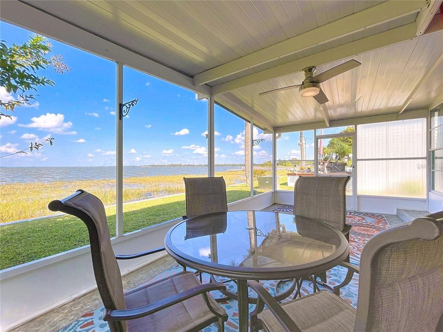 CALLING ALL WATER SPORT LOVERS, whether you are into FISHING, BOATING, WATER SPORTS or just LOVE the PEACEFULNESS of living RIGHT ON THE LAKE LOOK NO FURTHER.  LAKE FRONT to LAKE EUSTIS, PART OF THE POPULAR HARRIS CHAIN of LAKES.  This CUTE COTTAGE HOME is READY FOR THE NEW OWNERS.  FULLY FURNISHED, with UPDATED BATH, and KITCHEN.  NO CARPET, NEWER LAMINATE FLOORS, Lots of STORAGE.  Exterior Painted 1 year ago.  The HOME has AMAZING VIEWS of LAKE EUSTIS, and ACCESS to the OTHER HARRIS CHAINED LAKES.  RELAX on the SCREENED BACK LANAI, enjoy your FAVORITE BOOK, BEVERAGE, ENTERTAIN FRIENDS or TAKE-IN the BREATHTAKING SUNSETS. Just a short walk to the community FISHING PIER, and a HOP, SKIP and a JUMP from the BUZZARD BEACH BOAT RAMP.  NESTLED BETWEEN the WORLD FAMOUS DORA CANAL and DEAD RIVER CANALS. The Laundry Room is attached and through entry foyer.  The Community Club House offers Pool, Games, and Special Social Events with the Friendly Neighbors.   There is an TANKLESS HOT WATER HEATER and HOME WARRANTY INCLUDED!! Realtor Owned.