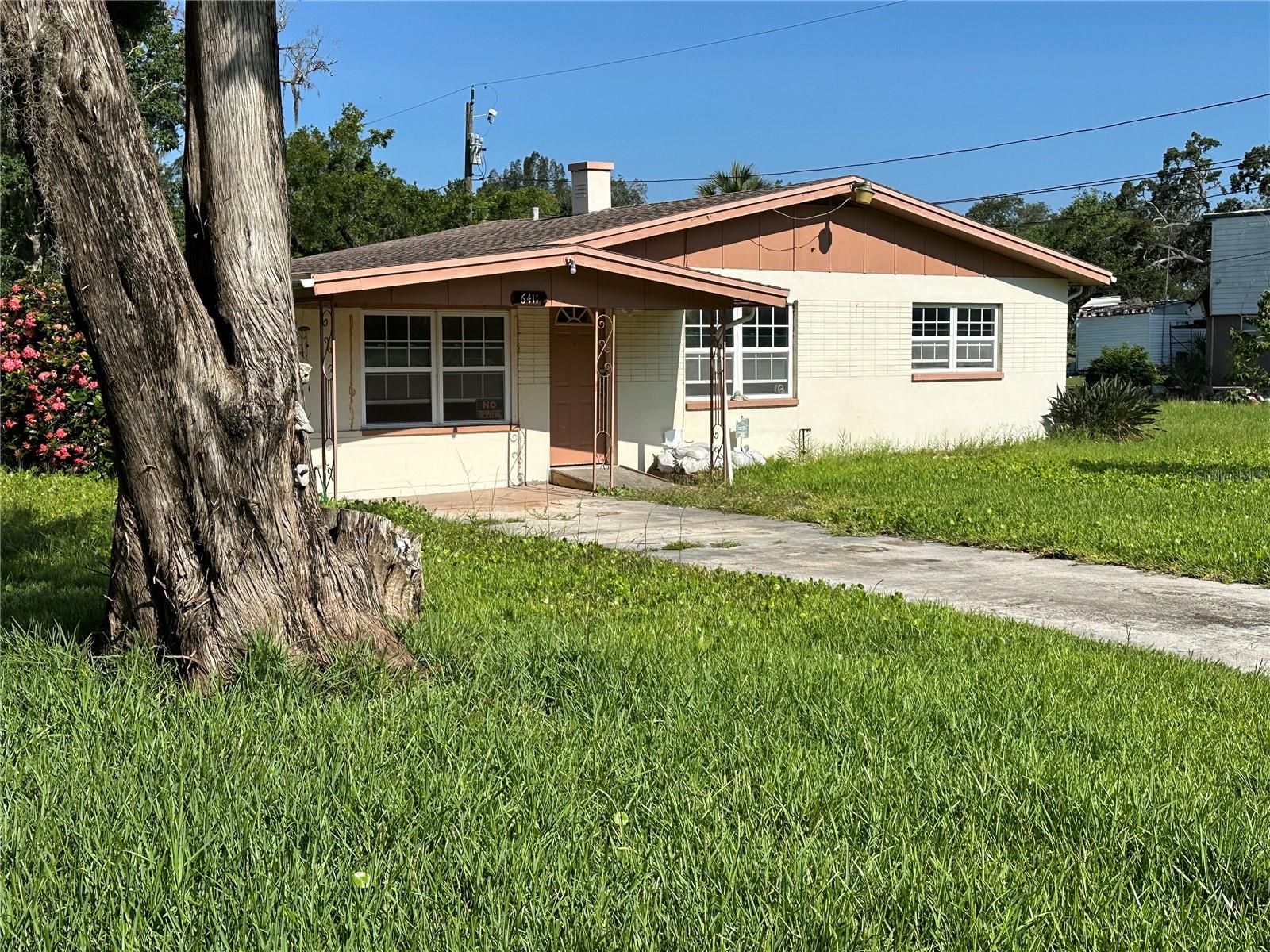 Incredible opportunity and potential. This property is on a double lot with a 936 sq ft, 2/1 with office primary residence and a 320 sq ft, 1/1 detached in law suite / apartment. Each residence does have its own address, the main residence is 6411 Werner Ave and the detached unit is 6415 Werner Ave. The units are on separate electric meters but share a water meter. Owners did plan to rebuild and remain in the residence but circumstances have changed. Home is close to Historic Downtown New Port Richey, Green Key Beach, hospitals, restaurants as well as Pasco Hernando State College.