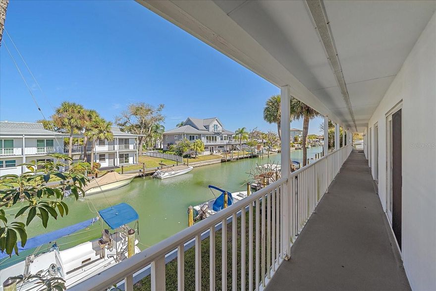 Sunsets on Venice Beach! Second floor condo is move-in ready. Located on a beautiful canal, with full access to the beach just a short walk away, complete with heated pool and large sundeck. Have coffee overlooking boats in the morning, then grab a glass of wine and enjoy a famous Venice sunset at the end of the day. Open and airy, sun filled and easy to maintain floor plan with blue water views from the Living Room and Bedroom. Walking distance to Venice Yacht Club, the Crows Nest, and the South Jetty and just minutes from downtown Venice. Sunning, shopping, biking, shell and shark tooth collecting - it all comes with Venice island living. Whether you're looking for a full time residence, a "Snow Bird" getaway, or a rental/investment property, look no further than this little gem!