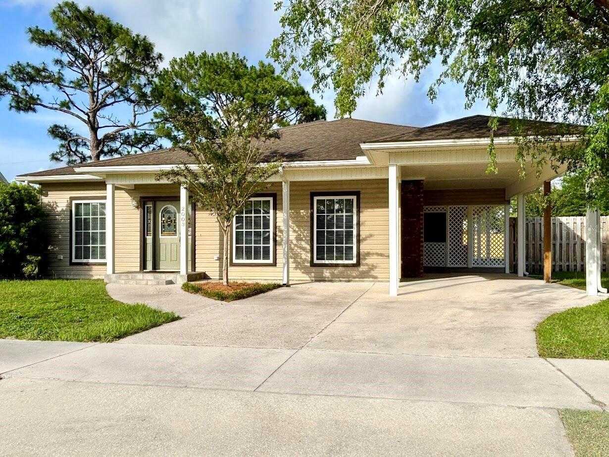 Coastal living at its finest! Designed with maximum comfort in mind, no detail was spared in this completely updated 4 bed/2 bath Florida home. Upon entry, you are welcomed by a large foyer, with natural light entering through three oversized windows, which transitions into a full dining and living area. The well-appointed kitchen features all new stainless-steel appliances, quartz countertops, and ample storage space. Three bedrooms visitors are situated down a hall in the left wing of the home, with a tastefully designed bathroom serving all three. Just off the kitchen and foyer is a large den with fireplace, a full-sized laundry/utility room, and the entrance to a private owner’s suite. Separated from the rest of the home for quiet and comfort, the owner’s suite features a large bedroom space, a sitting area that opens onto the backyard deck through French doors, and a large en-suite bathroom with stunning tilework. The exterior of the home boasts an oversized carport with side entrance, a spacious deck with covered, fan-cooled seating area, an open fenced-in yard, and a shed for storage/lawn equipment. With all new plumbing, wiring, HVAC, water heater, appliances, cabinets, counters, flooring, and so much more, this home is pristine!