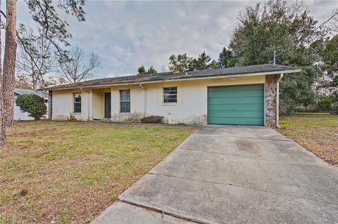 Photo of 21528 SW Honeysuckle Street, Dunnellon, FL 34431 (MLS # TB8474769)