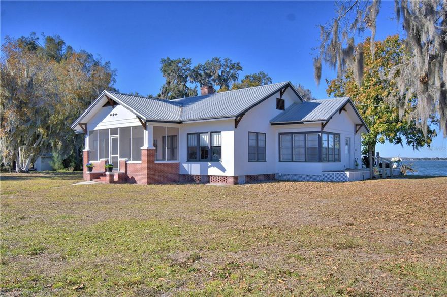 OLD FLORIDA 1928 CHARMER WITH 330± FEET ON LAKE REEDY!
Built in 1928 and thoughtfully remodeled to preserve its historic character and charm, this beautifully updated 3-bedroom, 2-bath home offers 1,740 square feet of living space on 1.5 acres with approximately 330 feet of frontage on Lake Reedy.
The home features an open living, dining, and kitchen area, highlighted by an original wood-burning fireplace, crown molding, and abundant natural light. The completely updated kitchen includes quartz countertops, a center island, and new appliances—perfect for entertaining while maintaining the home’s classic appeal.Recent upgrades provide peace of mind, including a new septic system (2021), all-new electrical wiring and plumbing (2022), a new HVAC system with heat pump, and new attic insulation (2023). 
Outside, the property boasts a 31x41 detached double garage with new electric doors, its own electric panel, and a separate septic system. The spacious garage offers endless possibilities—ideal for a mother-in-law suite, studio, workshop, or hobby space. A motor home hookup with 50-amp service, water, and septic is conveniently located beside the garage.
Enjoy true lakefront living with a private 100-foot dock and a 12x20 landing complete with water and electric at the dock—perfect for fishing, boating, or simply enjoying views of Lake Reedy.
A rare opportunity to own a piece of Old Florida charm with modern updates and exceptional lake frontage.