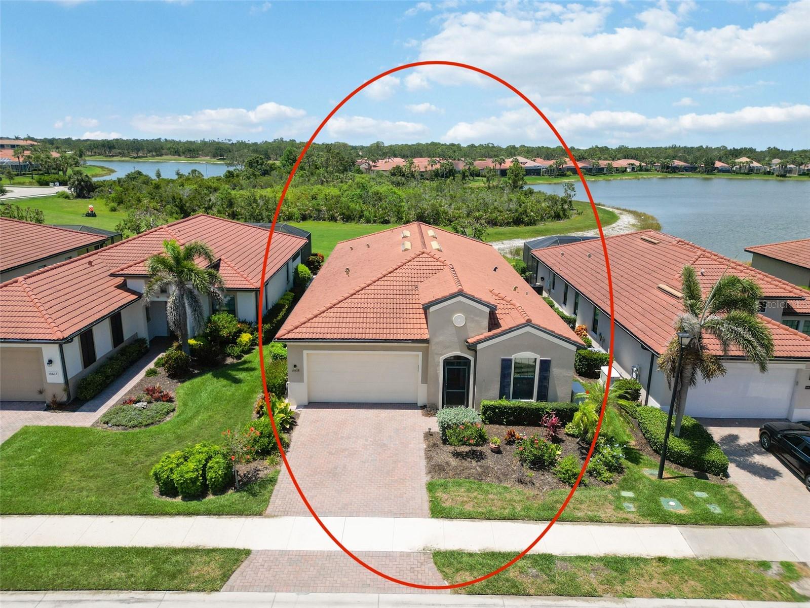 Welcome to 10618 Corkwood Court, featuring a WCI built Key Largo Floor Plan, nestled on a quiet cul-de-sac in the highly sought-after Lake Village of Sarasota National. This home features 2,378 sq ft of living space and boasts 3 bedrooms + a flex room, 3.5 baths, a 2 car garage and an extended lanai with preserve and partial water views for added privacy. Notable upgrades include a whole house Generac generator for uninterrupted power supply, an upgraded water softener and filtration system, and a comprehensive gutter and downspout system. Upon entering through the decorative glass front door, the grand foyer welcomes you with tile flooring, custom paint accents, and 8-foot doors throughout. The kitchen features dovetail constructed drawers with soft-close mechanisms, granite countertops, subway tile backsplash, and stainless-steel appliances including an upgraded refrigerator. The expansive island serves as the centerpiece, ideal for culinary endeavors and casual dining. The spacious living and dining area is highlighted by a tray ceiling with custom wood detailing and expansive sliders leading to the oversized lanai with gorgeous views. The primary suite, located in the rear of the home for optimal privacy, boasts decorative wood accents and oversized windows. The primary bathroom offers a lavish retreat with a sizable walk-in shower featuring seamless glass, a double sink vanity, a separate water closet, and a generously sized walk-in closet with custom shelving. The two additional bedrooms offer generous accommodations with ample closet space each features en suite bathrooms showcasing upgraded floor-to-ceiling tile and stone countertops. The den/office, adorned with glass French doors, serves as a flexible space with a closet, easily adaptable as a fourth bedroom. Additional features include a convenient drop zone off the 2-car garage and a separate laundry room with extra cabinetry and utility sink.
Sarasota National offers an abundance of amenities that elevate your lifestyle, including: Palm Club Restaurant & Bar * Tiki Bar with pool service (there is no mandatory minimum to be spent) * A heated resort-style pool with a dedicated lap section * bocce, playground, pickleball, and tennis courts * A 7,000-square-foot fitness center with exercise classes *Dog park * A luxurious spa. Enjoy peace of mind with exterior maintenance fully covered by your HOA fees, allowing you to focus on what matters most. Ideally situated just minutes from pristine area beaches, the charm of Historic Downtown Venice, and the dynamic Wellen Park development, Sarasota National offers a lifestyle you truly deserve.
Don’t miss the chance to make this premier community your new home — where every day feels like a vacation.
