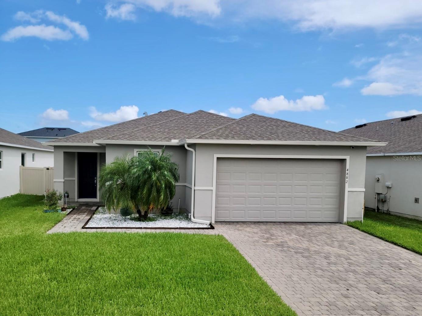 **More pictures to come soon!**
Welcome to 4882 Knoll Lane, St. Cloud, FL!! Step into this beautifully maintained 3-bedroom, 2-bath home, built in 2019, located in a quiet, family-friendly neighborhood with highly rated schools.
Designed with comfort and style in mind, the home features an open floor plan, elegant tile flooring throughout, and a modern kitchen with stone countertops, all stainless steel appliances included — plus washer and dryer.
Enjoy Florida living in covered lanai, fully fenced vinyl backyard, complete with paver covered patio and a cozy fire pit, —perfect for the family to enjoy weekend barbecues or winter s'mores, just to relax or entertaining guests. Other highlights include a 2-car garage, installed gutters, and thoughtful upgrades throughout. This home is move-in ready. Come visit and envisioned yourself home!