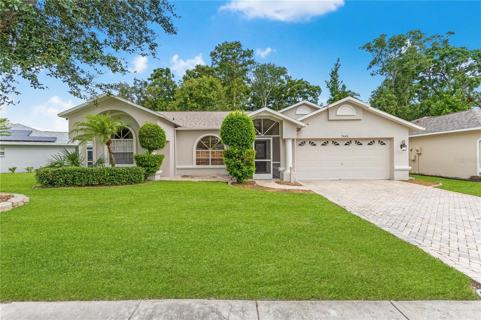 For your convenience, RENT INCLUDES: Lawn Care, Trash Pick-Up, A/C Filters, Salt for Water Softener and Pest Control! This immaculate and upgraded home on a conservation lot is a must-see, featuring 3-bedrooms, 2-bathrooms and 2-car garage with an extended paver driveway. Inside, soaring ceilings, neutral tones and ceramic tile floors throughout (NO CARPET) set the stage for an inviting living space ready to
complement your personal style. The kitchen features expansive granite countertops, solid wood cabinetry, and STAINLESS appliances, giving you a functional and stylish space. Two separate family rooms with ceiling fans and glass sliders that open to a SCREENED and COVERED LANAI, perfect for indoor-outdoor living. The lanai overlooks the paver patio and FENCED BACKYARD offering an ideal spot to enjoy your
morning coffee, host weekend barbecues, or simply relax in the fresh air. The split floor plan provides privacy, with two bedrooms tucked in the back, each featuring a walk-in closet and remote ceiling fan. Your private retreat awaits in the primary en-suite on the
opposite side, complete with: (2) WALK-IN CLOSETS, ceiling fan, dual sinks, towering solid wood cabinets, a soaking JACUZZI tub, separate shower and private lanai access. For everyday convenience, you’ll appreciate an inside laundry room with extra storage and a clothing rod, a utility sink in the garage for quick cleanups, and a screened front porch to keep delivered packages dry. Recent upgrades for peace of
mind include: NEW ROOF (2025) HVAC (2023), WATER HEATER (2024). This home places you at the center of some of Florida’s most desirable destinations. Enjoy quick access to the Gulf of America, Clearwater Beach, the Anclote Fishing Pier, and the historic charm of Tarpon Springs with its famous sponge docks and waterfront dining. Sims Park and the vibrant downtown New Port Richey area are just minutes away,
offering live music, community events, and countless restaurants to choose from. Shopping, grocery, golf, and medical facilities are also nearby. Whether you’re seeking tranquility, community, or exploration, this home’s location has it all. Schedule your private tour today!