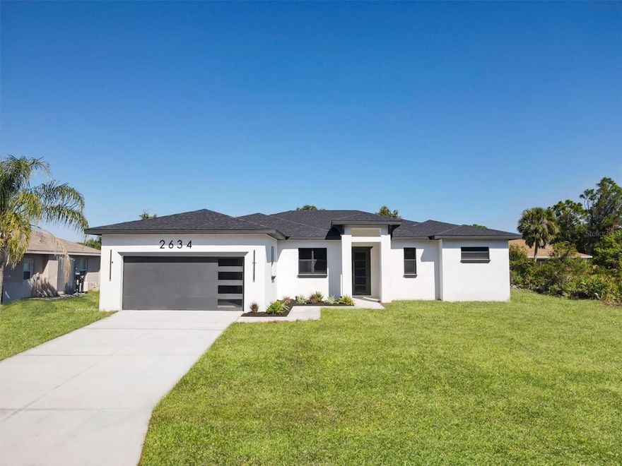 Welcome to 2634 Colorade Ave., a striking new construction custom home offering almost 2200 ft.² of living space with a 3000 ft.² total footprint. This home comes with a full one-year warranty from the date of purchase as well as a $500 Visa card to the buyer at closing .
This home features 9.4 ceilings in the living room, dining room and master suite. Miami Dade approved impact windows and aluminum doors. This home has 8 foot solid wood interior doors, with 8 inch base throughout the home .
This resident exudes quality from the moment you step inside. The gourmet kitchen is equipped with a 42 inch solid wood soft close cabinets, quartz countertops , stainless steel appliances, a microwave/oven combo farmhouse sink and a generous 10 foot island with Storage on both sides idea for entertaining or family gatherings. There is also a pantry built in includes a work station, Each bedroom is served by its own HVAC return for enhance comfort. The owners retreat boast an enormous walk-in closet and a luxurious glass double shower ensuite. Porcelain tile measuring 48 x 24”. retreat boast an enormous walk-in closet. Porcelain tile measuring 48 x 24“ flows throughout the home unifying the space with elegance. The oversize lanai expand your living under the Florida skies. Located just minutes from shopping dining and the Gulf Coast celebrated beaches and amazing schools. This home offers the perfect blend of modern finishes, durability and lifestyle. There is no other house for sale in this neighborhood that compares to this one. This area of North Port is known for the highest lots. THIS HOUSE IS 100% COMPLETE ALL PHOTOS ARE REAL!
