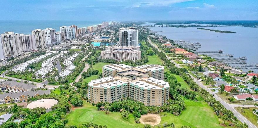 Welcome to Paradise at 4 Oceans West - Cloverleaf nestled on the Ocean Golf Course just across A1A from the Pristine Atlantic Ocean. Come Live the Coastal Dream in this Incredible Resort Style Beachside Community with Amazing Amenities, a Carefree Lifestyle of "Fun in the Sun", and Perfectly Located for Every Convenience from Shopping to Dining, and Biking, Golf, Tennis, Pickle-ball, Fitness Center, Indoor & Outdoor Pools and a Hot Tub, Sauna and even an Assigned Garage Parking Space (#112) on the Same 4th Level just Steps from your Door! This Beautiful Condominium Features an Open Concept Main Area with a Lovely Kitchen and Breakfast Bar plus a Dinette Area, the Combination Living Room and Dining Room lead to a Spacious Balcony that Extends your Private Living Space to the Outdoors with Views of the Impeccably Maintained Golf Course and Distant Ocean Views to Watch the Sunrises. There are 2 Bedrooms in a Split Floor Plan for Privacy, the Primary Suite Includes an Ensuite Bath, Walk-In Closet and Sliding Doors to the Large Balcony. The 2nd Bedroom and Bath are Perfect for Extended Family or Guests. There is an In Unit Laundry Center for Easy Living and also  Extra Closet Space. The Community has an Elevator,  Gated Parking Garage and an On Site Manager, they Allows 2 Pets - 20 Pounds Total, and offers a Bicycle / Scooter Storage Area, a Library, a Social Room and guest parking. The Motto, " Life Is Better Here" just Perfectly Describes this Amazing Opportunity to Live in Luxury at an Affordable Price in the Best Location! *The Seller is also Offering a Bonus $5,000 to the Buyer for New Flooring of their Choice!