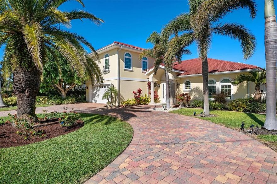 Make your island dreams come true in this fabulous 2,584-SF pool home located on a deep-water canal in the exclusive Key Royale community. The well-maintained property offers a long dock with a 10,000-lb. boat lift, floating Jet Ski dock and direct access to Tampa Bay and the Gulf of Mexico. Inside the 4-bedroom, 3.5-bath home, you’ll enjoy open living spaces for family gatherings and entertaining as well as space and privacy, with two generously sized master suites with walk in closets – one on the main level and one upstairs. The well-appointed kitchen and spacious dining area open to vaulted ceilings in the living room. Glass sliders lead to a private covered patio, canal-front pool and outdoor kitchen/bar, surrounded by palm trees, lush landscaping and a variety of fruit trees including mango, avocados, bananas, guava, fig, olive and citrus. Impact-resistant windows and doors are found throughout the home along with easy-to-maintain bamboo and tile flooring. Other highlights include spray foam insulation, two Nest thermostats, Toto Neorest toilets, a two-car garage with central heat and air and an expansive circular paver driveway for added parking and much more. Key Royale residents have the option of joining the private Key Royale Golf Club, which has the island’s only golf course, as well as dining and social activities. You also will be just a golf cart ride away from Anna Maria Island’s beautiful nearby beaches and all points of interest to enjoy the island lifestyle! Call for your private showing today.
