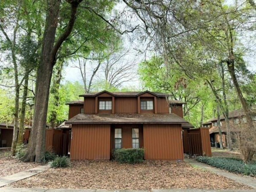 Welcome to this spacious 3-bedroom, 3-bath townhome in the highly desirable Rockwood Villas community in Gainesville. This two-story home offers a functional layout with an open living and dining area that flows seamlessly to the outdoor space, creating a comfortable setting for everyday living and entertaining. Sliding glass doors lead to a screened porch—perfect for relaxing with your morning coffee or enjoying the peaceful, tree-lined surroundings.

The home features tile flooring throughout the downstairs main living and kitchen area, with luxury vinyl plank flooring upstairs. There is no carpet in the home, offering a clean and low-maintenance living environment.

The association covers common areas, roof, siding, lawn care, pest control, and pool maintenance, allowing for easy, low-maintenance living.

Rockwood Villas is known for its mature landscaping and convenient location close to the University of Florida, Butler Plaza, Celebration Pointe, and The Oaks Mall, with easy access to major roads and bus routes. Residents enjoy a variety of community amenities including swimming pools, tennis courts, volleyball courts, and a clubhouse.

Whether you're looking for a primary residence, investment property, or a home near campus, this townhome offers comfort, convenience, and a fantastic Gainesville location.