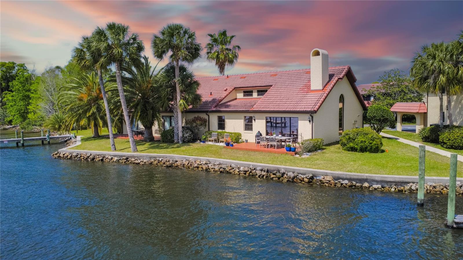 Welcome to your slice of paradise at Casa Rio Condominiums, where luxury and tranquility come together on the serene banks of the Crystal River. This meticulously remodeled condo is not only the largest in the community—it’s a stunning showcase of modern elegance and waterfront living. Inside you will be captivated by soaring vaulted ceilings with rustic wood beams, a fireplace accent, and breathtaking river views that set the tone for relaxation. The gourmet kitchen presents top-of-the-line appliances, custom cabinetry, and gorgeous quartz countertops—perfect for both entertaining and everyday meal preparation. Interior features two bedrooms downstairs and a flexible loft space ideal as an additional bedroom, home office, reading nook, or media room. The spa-inspired bathrooms offer a retreat of their own, finished with elegant fixtures and a designer’s touch. Start your mornings with sunrises over the water and wind down with sunset views that take your breath away. For the avid boater, this condo offers the ultimate convenience with its own private boat slip, providing direct access to the Crystal River and just a short 10-minute journey to the Gulf to explore waterways and discover hidden gems along the beautiful nature coast. Additional perks include a two-car covered parking area, an outdoor storage closet, community pool, and a riverside outdoor area that’s perfect for morning coffee or hosting friends for a sunset BBQ. Don’t miss this rare opportunity to own a luxury waterfront condo in one of Florida’s most beautiful natural settings.
