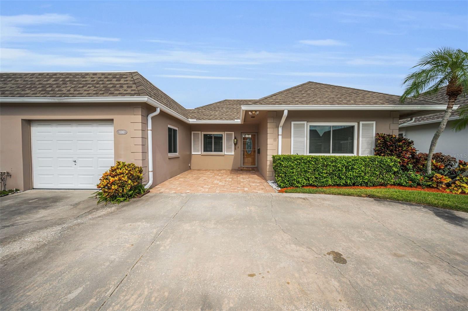 Fantastic Villa which sits on the 9th Fairway of Seminole Lake Golf Course. Seminole-on-the-Green Villas, a 55 and over community, is a quiet boutique neighborhood, only 80 villas tucked away in a residential neighborhood, yet centrally located to major roadways. Close to beaches, shopping, restaurants and much more. This meticulously maintained two bedroom, two bath home with amazing golf course views, has tasteful upgrades which also include water softener, hurricane rated windows/doors (2019) and recently replaced roof (2022), water heater (2022), HVAC (2021) and ducts (2022)! Beautifully landscaped front entry sets the stage for this bright and serene home. You'll appreciate the split bedroom plan for privacy. Attached garage is convenient to kitchen to unpack groceries, plenty of storage space throughout plus inside laundry area. Light cabinetry and accents in kitchen blend in beautifully with solid surface countertops, with a double sink overlooking lush outside greenery through the dining area where you will feel like you are sitting in a garden. An oversized (25x16) screened and roofed patio on one end, open area on the other, perfect for barbecue and entertaining. The spacious master suite has an amazing cedar lined walk-in closet, full bath and updated vanity along with an oversized tub/shower. This home is a must see. You can make new friends at the community pool or shuffle board, and may want to consider a membership at the Seminole Lake Country Club, which offers reasonable rates for tennis, golf and social memberships. Check this special Villa Home, You won't be disappointed!