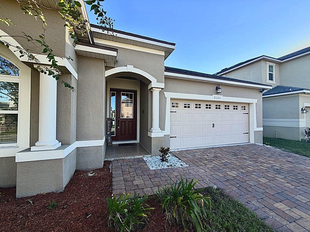 Photo of 2121 Avian Loop, Kissimmee, FL 34741 (MLS # O6445376)
