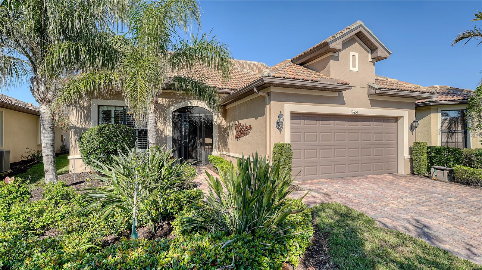 Celebrate living the good life here! Absolutely STUNNING 3 Bed, 3 Bath home with den and WATER VIEWS in the popular IslandWalk community in Wellen Park!
Sellers selected the spacious Martin Ray floor plan with second-story loft, designed with a living space, bedroom, bathroom and bonus 5ftx5ft storage closet upstairs, making the total living area in this home a fabulous 2,725 sq. feet! A perfect floor plan layout for your family and guests. The beautiful kitchen finishes and gorgeous plank floor tile in the living areas were selected by the sellers as builder upgrades when built. The gourmet kitchen has granite countertops, a generous-sized island, stainless appliances, on-trend tile backsplash, designer light fixtures (including under-cabinet lighting), rollout trays in the lower cabinets, a raised dishwasher for easy loading/unloading, and a 5-burner range top for the chef in the family! There's a fabulous dry bar area with more granite countertops, mini-fridge, and wine rack across from the walk-in pantry. Light finishes and complementary colors are carried throughout the home, giving the space a bright and airy feeling. The open concept Kitchen/Living/Dining area has pocket sliding glass patio doors that open up to the extended lanai, complete with an outdoor kitchen with sink, mini-fridge, gas grill and two side burners, perfect for indoor/outdoor entertaining and relaxing together to watch spectacular sunsets. Many more upgrades to note: pull-down sunshades in lanai, plantation shutters and crown molding in the living/dining room and primary bedroom, easy-to-close accordion hurricane shutters on the second story windows, 8ft interior doors throughout, the list goes on...
The 2-car garage was extended 4ft, and has an additional golf cart space (the fun way to get around IslandWalk and Wellen Park) or use it for extra storage space.
IslandWalk is a premier, guard-gated community in a great location with an abundance of amenities to experience, including a luxury Resort Center, community clubhouses, fitness center, 2 resort-style community pools, lap pool, dog park, tennis and pickleball courts, and plenty more! There's a full-time activities director on site to keep your calendar loaded with fun activities to try. Only a short drive to beautiful Venice Beach on Venice Island or explore nearby downtown Wellen Park with year-round events, retail shops, delicious restaurants, the Atlanta Braves spring training stadium at Cool Today Park and more just waiting for you to discover. Isn't it time to make this much-loved and well cared for home yours?