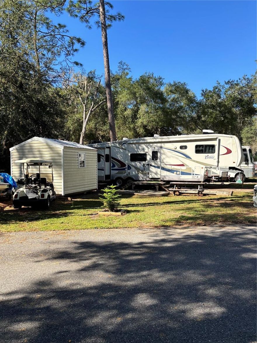 Awesome 2006 43' Cardinal Forest River on corner lot in Salt Springs Resort! New laminate flooring throughout (2024). Roof resealed 2023. Front A/C 2024, back A/C 2023. Living room can be closed off for privacy and also has an electric fireplace. Tons of storage! Includes golf cart, jet ski, smoker, and gas fire pit. New (2024) hurricane proof 10x10 aluminum shed with washer/dryer hookups. The freezer and refrigerator in the shed are included. There are 2 outside water spigots for washing off jet ski, golf cart, etc.  Amenities include community boat ramp to Little Lake Kerr w/ dock, 2 pools, hot tub, dog park, playground, shuffleboard, horseshoes, tennis/pickleball courts, lodge, game room and more!   Close to Salt Springs Recreation Area. Great opportunity to live here, use as a weekend retreat or as an investment property!