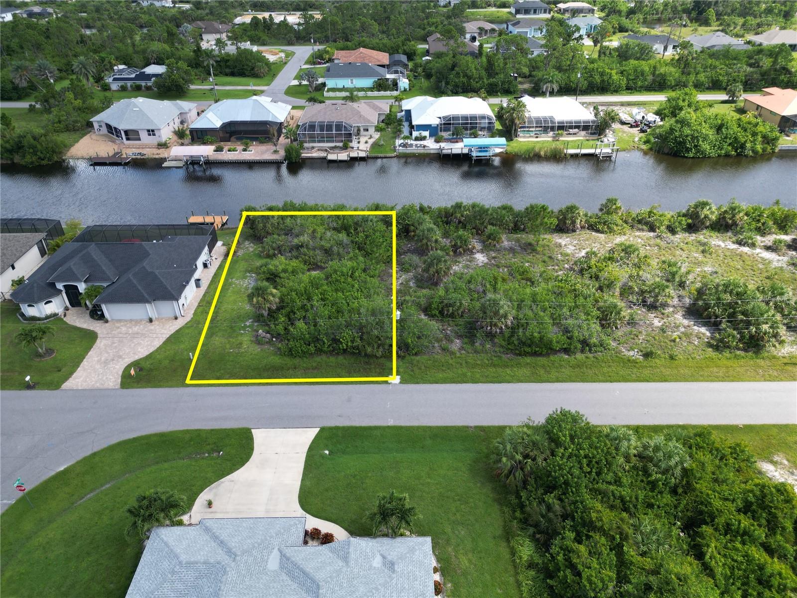 Waterfront property in the exciting boating community of South Gulf Cove, a prime location for designing a custom home tailored to your family's desires. This exquisite lot boasts an expansive 80 feet of canal frontage, offering breathtaking views and a connection with nature, complemented by boundless boating adventures. Envision tranquil evenings by the water's edge and waking up each morning to stunning views. South Gulf Cove is a deed-restricted, boating-centric community with an optional annual HOA, featuring public boat ramps, clubhouse and access to 55 miles of canals and the open waters of Charlotte Harbor, Intra-Coastal Waters and the Gulf. Experience the Florida lifestyle with top-tier golfing, thrilling boating, exceptional fishing, and the enchanting allure of nearby beaches. Immerse yourself in a vibrant community life where adventure and relaxation await at every turn. We work with builders in all price ranges, Let South Gulf Cove be the setting for your new coastal life.