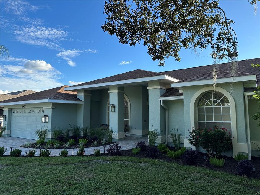 TOTALLY UPDATED POOL HOME WITH BOAT LIFT AND GULF ACCESS. This is your chance to live in a great home on the water without being in a flood zone. This is X flood zone. No flood insurance required. This 3 bedroom 2 bath home has all new LVP flooring, kitchen, bathrooms, appliances, fixtures, trim, paint, outdoor kitchen and paver driveway. All cabinetry is dove tail with soft close feature, and all counters are quartz. The floor plan is spacious, bright and open with high ceilings, huge windows, and a wood burning fireplace that is shared between the family room and the 3rd bedroom or den. The open kitchen is amazing and overlooks the family room. The living room, family room and primary bedroom all have large windows and sliders leading to the screened and covered lanai and pool. The outdoor living space is beautiful and tranquil with an awesome view of your shade trees, dock and river. Enjoy watching the visiting Manatee, jumping Mullet, and rolling Tarpon from your updated dock. After boating for the day, you can lift your boat out of the water, jump in the pool, and cook the catch of the day at your amazing outdoor kitchen. Then have a cocktail and watch a beautiful sunset from your shaded deck. River Landings also has a community pool and dock, and is only a few miles to I-75. Low HOA and no CDD fee. This location is convenient to Lakewood Ranch, UTC Mall, Sarasota, Bradenton, restaurants, shopping, and golf. 
This home is great for entertaining and enjoying the Florida lifestyle.