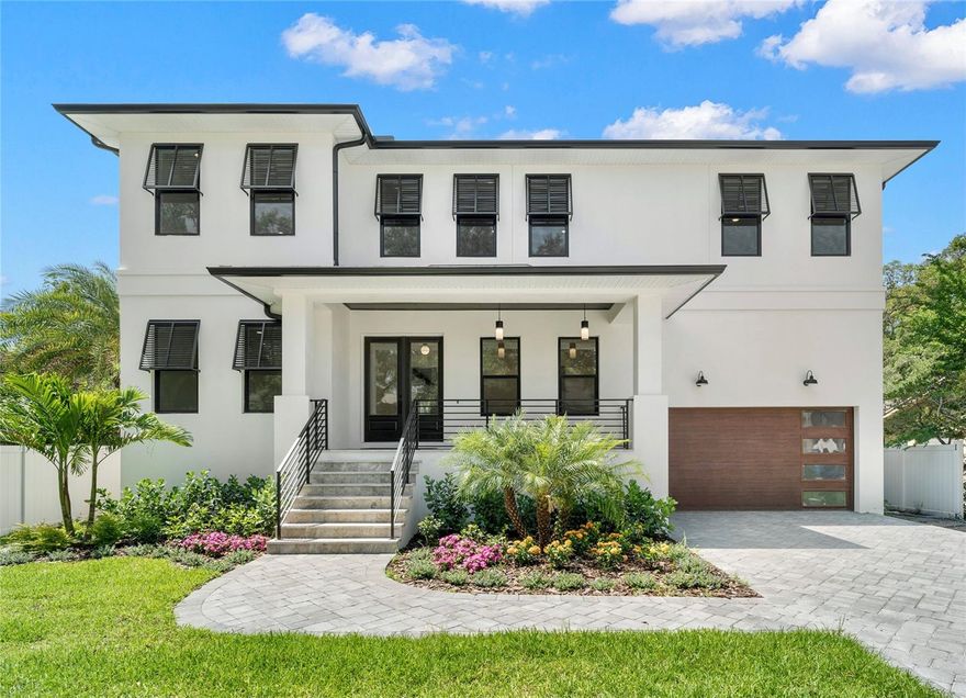 Under Construction. Move in ready September 2023. Almost finished this new luxurious and elegant modern transitional residence is located in the heart of South Tampa’s beautiful Sunset Park neighborhood.  Designed with livability in mind, this stunning home has 4 bedrooms, 6 full baths, a study/guest suite plus a bonus room.  With 4810 sq ft. featuring many amazing luxury finishes throughout.  Beautiful wood work and crown moldings along with wide plank engineered wood flooring throughout and 8’ tall solid wood doors illustrate incredible attention to quality and detail.  
Double door entry and impressive foyer welcome you to this fabulous open floor plan home. You will enjoy the extraordinary gourmet chef's kitchen with stainless steel appliances, custom cabinets with loads of space, an oversized island, quartz countertops, under cabinet lighting, large eat in breakfast space, a walk in pantry and separate butler's pantry with wine fridge.  
The expansive great room opens up to your private retreat featuring a resort like pool/spa and outdoor kitchen area great for entertaining.  If outdoor living is your way of life, then this home will not disappoint.  This amazing backyard oasis features an expansive covered lanai with travertine floors and Vinyl fencing, and abundant lounging, sunning and green playing areas where the entire family can rest, rejuvenate, play and come together.
This exceptional home’s main floor also boasts an open concept with a spacious Great room, formal dining room, an office/guest suite, wine closet and a mudroom.  Upstairs you will find the owner’s retreat, with 2 enormous walk-in custom designed closets and a spa inspired bathroom with floor to ceiling tile, and free standing tub.  3 more bedrooms each with ensuite bathrooms and walk in closets, a large bonus loft and a generous laundry room complete this level’s floorpan.
Full security system. Electronics closet allowing for hidden wireless entertainment system. Pre-wired for surround sound. Soft close cabinet doors and drawers. 2 tankless gas water heaters for endless hot water. tropical landscaping and new fencing to enjoy the expansive back yard for entertaining.  Energy efficient Low-E impact glass windows. 10 yr structural warranty.  Completed pool photos are of the builder’s recently completed similar project.
Designed to surpass your expectations of quality, styling and craftsmanship.