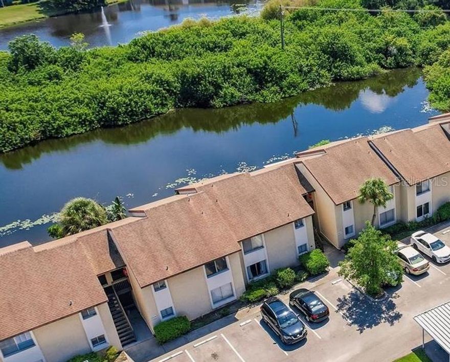 Enjoy peaceful lake views from this fully renovated 2 bedroom, 2 bathroom condo in Hidden Lake Village!  Features include new flooring, new appliances, new modern vanities with lighted mirrors, and fresh paint throughout.  The open layout flows to a private balcony overlooking the lake, perfect for relaxing.  Community amenities include two pools, a fitness center, billiard room, clubhouse and tennis courts.  Located minutes from downtown Sarasota, beaches, and UTC Mall.