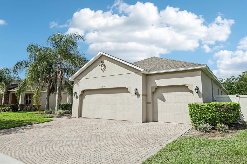 Photo of 12126 Homestead Park Lane, Orlando, FL 32824 (MLS # O6410424)