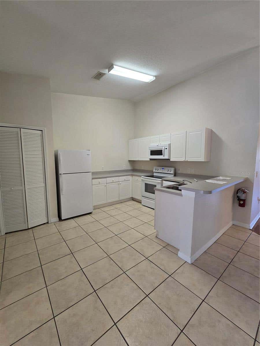 Photo of 2790 Club Cortile Circle #B, Kissimmee, FL 34746 (MLS # S5155306)
