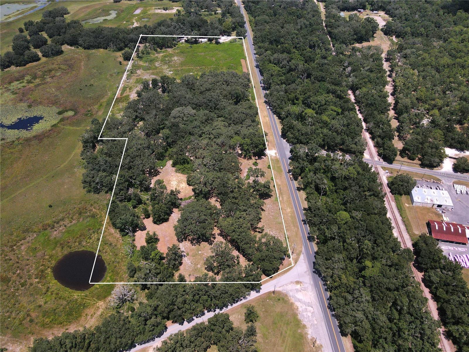 One-Of-A-Kind 20 acres of Vacant Land, with improvements, in the Heart of Horse Country! Mixed use 20 acres (RAC & A-1) Vacant Land in a Great Location with 1500 feet on US Highway 41. This property has 9 acres on South End of the property zoned Rural Activity Center (RAC) for future land use, which allows for a large number of commercial business entities (but still can be used as agricultural/residential if new owner desires); then the remainder of 11 acres North of that, with US HWY 41 road frontage, is zoned A-1 (agricultural). This is a highly Versatel property that offers an endless possible number of uses. Highway 328 intersects= US Hwy 41 across from the property creating high visibility & a high number of road trips. Located 12 minutes from the World Equestrian Center, 12 minutes to Dunnellon, & 12 minutes to Williston; in the Middle of Horse country! There is an in Ground Electric Box hookup installed, plus new 4" well that has been installed. Limerock road work has been established on the property. A few areas have been cleared as possible build sites. There are Many Large 100-year-old Grandaddy Oaks on the Property. Truly a Must SEE! The Oaks are incredible! Great Value!