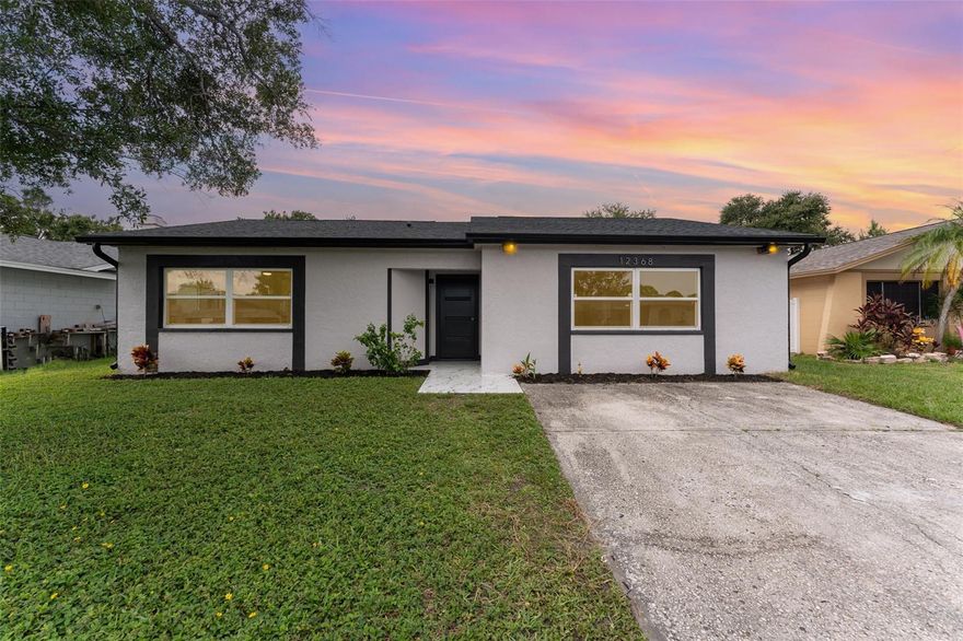 Unique property in Pinebrook Estates! This fully remodeled 4 bed / 3 bath / 2,128 sq ft home offers stylish upgrades and unbeatable convenience. Featuring TWO independent MASTER SUITES; one with a spa-like bath and freestanding tub, and the other perfectly suited as a private in-law suite; this home offers flexible living for today’s lifestyle! A brand-new kitchen with quartz island, modern cabinetry, and sleek appliances, plus luxury vinyl plank flooring throughout, no carpet! Every bathroom has been beautifully updated, and open layout with a large backyard perfect for entertaining or relaxing. Major updates include newer second AC for Master Bedroom addition (2023), Main AC unit (2020), tankless water heater (2025), and roof (2018). Located in a no-flood-zone community surrounded by newer homes, this property is a smart investment and move-in ready. Just 20–25 minutes to Indian Rocks Beach, Tampa International Airport, Downtown Tampa & Clearwater, and only 5 minutes to grocery stores, top-rated schools, and St. Pete–Clearwater Airport. Florida living at its best!