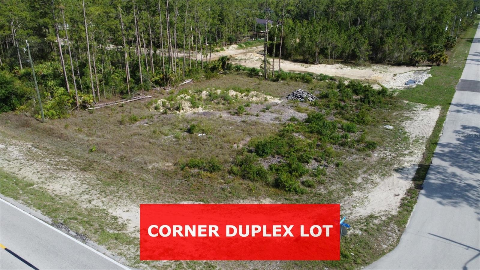 **DUPLEX ZONED CORNER LOT, and already CLEARED** in a Prime Location! Large, oversized lot at .43 acres. Environmental report available showing this is a 100% upland lot with no turtles. This highly sought-after CORNER duplex lot is situated in the increasingly popular area of Lehigh Acres. The lot backs up to a canal, so there is an easement behind the lot so makes it look larger... plus being on the corner, it's already larger than interior lots. It is zoned for both duplex construction and single-family homes. The neighborhood is experiencing a surge in newly constructed duplexes, making it an ideal time to invest before property prices soar any further. The seller has a variety of other duplexes and single-family home lots available in the Lehigh area. You'll find convenient access to grocery stores, schools, and various amenities. Plus, the region boasts easy access to the major RSW Southwest International Airport, opening doors to a world of adventures, including Fort Myers Beach, JetBlue Stadium (home to the Red Sox spring training), and Hammond Stadium (home to the Twins spring training). For those who love outdoor activities, there are numerous options nearby. Explore the Lehigh Acres Community Park North, the Lehigh Acres Trailhead Park, or the Lee County Manatee Park, which offers waterfront experiences with paved trails, up-close manatee views. If you're into hiking and mountain biking, the Caloosahatchee Regional Park is just around the corner, covering almost 770 acres.