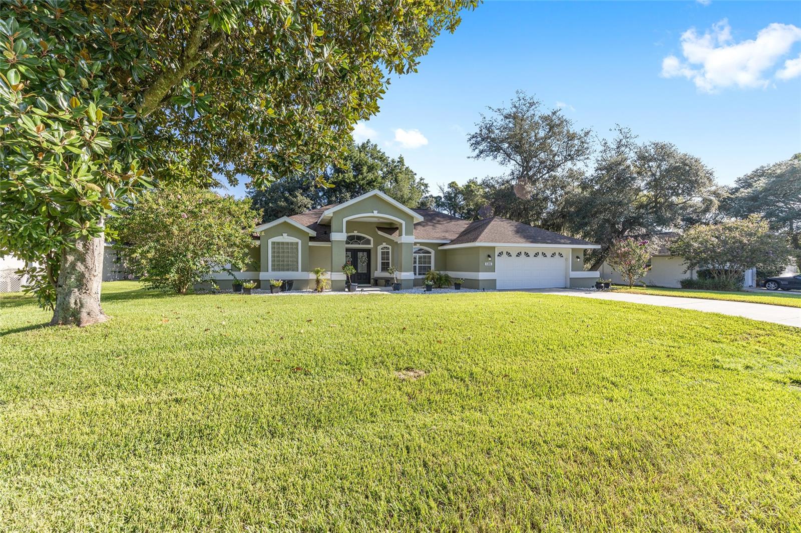 As you drive up to your Florida Dream Home, you are greeted by pure beauty. With 2,250 square feet of living space, the large open floor plan offers plenty of room for families of all sizes. This beautiful pool home features a thoughtfully designed layout with tastefully chosen finishes. The open-concept floor plan offers space to entertain or relax, with a large island kitchen that flows seamlessly into the dining and living areas. Each bedroom has convenient access to a bathroom. The primary suite will be your very own private oasis. The pictures provide just a glimpse; an in-person tour will provide you with the feelings of both luxury and serenity. Step outside to enjoy the expansive screened-in lanai, where you can entertain or wind down by the private pool. This is a must-see and a great opportunity to own a beautiful, move-in-ready pool home in a well-established SW Ocala neighborhood. Majestic Oaks is one of SW Ocala's most sought-out neighborhoods for retirement, raising a family, or any stage of your life in between. This neighborhood is known for being well-maintained, clean, and having friendly neighbors. Close to shopping, restaurants, medical facilities, schools, places of worship, parks, and more. New AC (2022), New Roof (2016), Remodeled (2022). A renewable One Year Home Warranty is included.