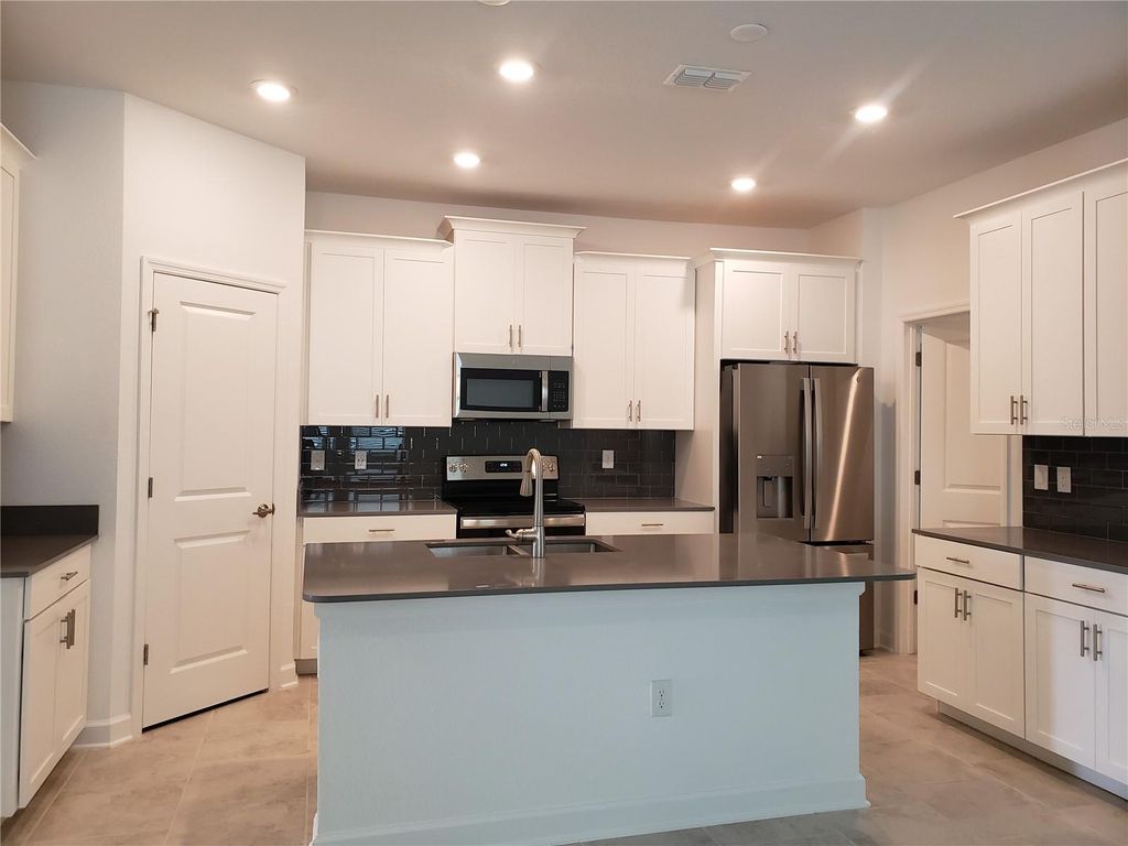 Photo of 5604 Quiet Palm Loop, Saint Cloud, FL 34771 (MLS # O6369548)