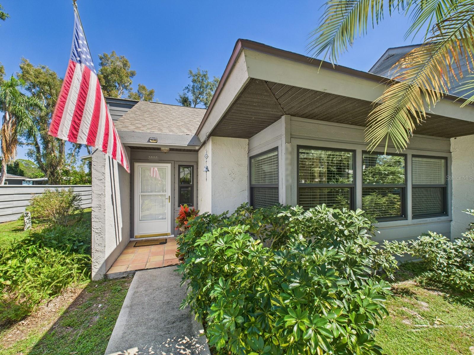 For the first time in over a year, a villa in this sought-after "oasis in the heart of everything" is hitting the market. Welcome to Eagle Chase, a charming and serene neighborhood known for its vibrant, mature landscaping and tranquil ambiance. This 2-bedroom, 2-bathroom villa offers 1,267 square feet of well-designed living space. Features include a spacious pass-through kitchen, a vaulted-ceiling dining/living room, and not one but two screened porches—plus an open deck perfect for relaxing or entertaining. Recent updates ensure peace of mind: a new roof in 2020, HVAC system installed in 2024 with regular maintenance, and a water heater replaced in 2018. Eagle Chase boasts a prime central Sarasota location, just minutes from top destinations: South Siesta Key Bridge – 2 miles; Siesta Key Beach – 4.3 miles; Red Bug Slough Preserve – 0.4 mile; Legacy Trail – 2.1 miles; SMH Urgent Care – 1.8 miles; Sarasota Memorial Hospital – 4.7 miles. Whether you're seeking tranquility, convenience, or proximity to nature and amenities, this villa offers the perfect blend. Don’t miss your chance to own in this rarely available and highly desirable neighborhood!