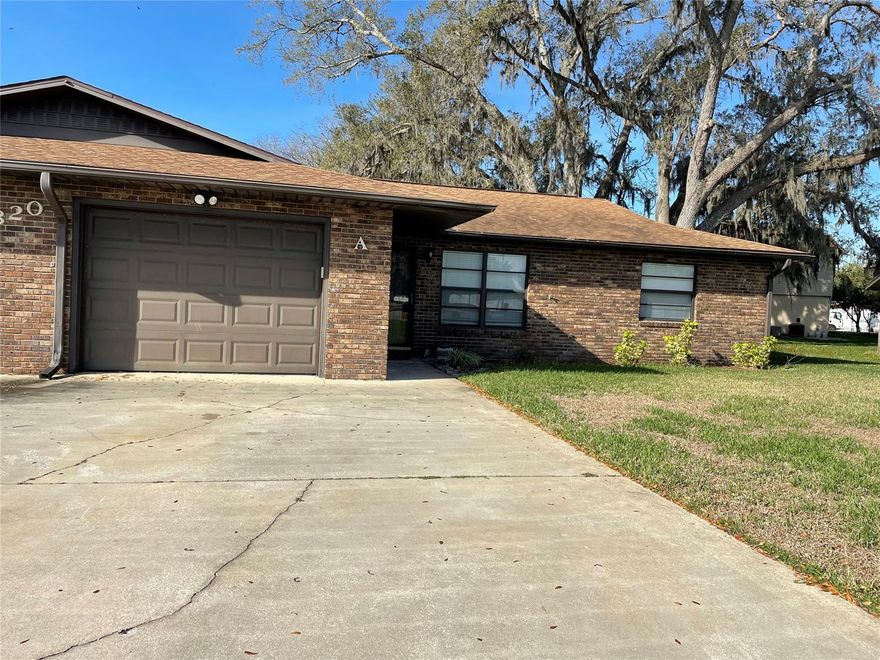 Centrally located 2 bedroom 2 bath attached home in New Smyrna Beach.  This clean and cheerful home with low maintenance brick exterior and updated roof in 2018 has fresh paint and new carpet in the living and bedrooms.  The kitchen is open to the dining room with tile floors, stainless appliances and french doors opening onto a screened porch.  The 1 car garage with extended depth holds the washer and dryer while still leaving room for your car or truck. ;Water: City