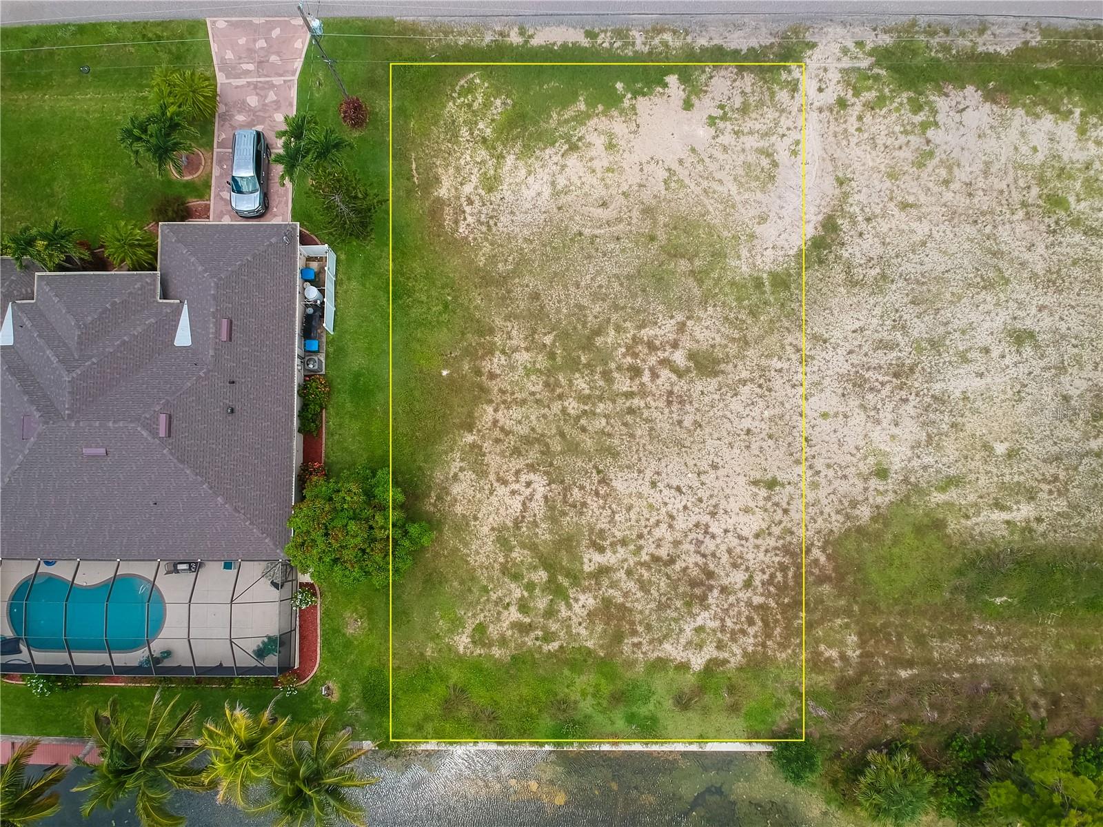 WATERFRONT lot on a FRESHWATER CANAL with an 80-foot concrete sea wall located in Cape Coral. NO HOA FEES! Enjoy peaceful water views along the wide canal, ideal for kayaking, canoeing, or fishing right from your backyard. This is not a Gulf-access lot, offering serene, low-traffic waterways perfect for nature lovers and those seeking a quiet escape. Located in a growing area of NW Cape Coral with newer homes nearby, this lot offers easy access to major roads, shopping, dining, schools, and parks—while still giving you the tranquility of canal-front living.