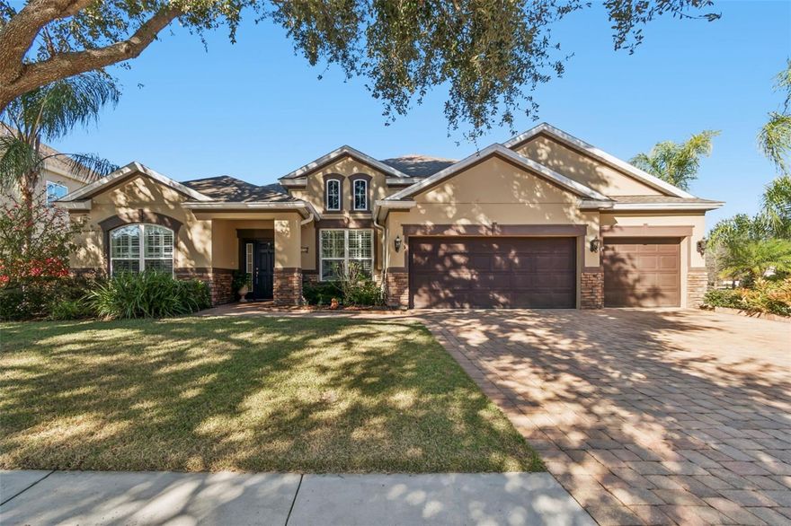 Welcome to this exceptional 4-bedroom, 3-bathroom residence with a dedicated office. Located in the peaceful Lake Magdalene/Carrollwood corridor, this meticulously maintained home blends elegant design with privacy and thoughtful upgrades throughout.
From the moment you arrive, the stately curb appeal & wide paver driveway make a lasting impression. Step inside to a grand foyer that leads to a double-door office with tile flooring and plantation shutters—ideal for remote work or study. The triple-split floor plan provides effortless flow and privacy. Formal living and dining spaces offer the perfect setting for gatherings, while the chef’s kitchen is equipped with granite countertops, 42” cabinetry, stainless steel appliances, and a walk-in pantry with butler’s pass-through. The kitchen opens seamlessly to the expansive family room and casual dining area, featuring high ceilings, built-in surround sound, and French doors that spill out into your private backyard escape. Outside, enjoy a fully fenced oasis complete with lush landscaping, screened-in heated pool and spa, insulated covered lanai, ceiling fans, and outdoor stereo speakers—ideal for year-round relaxation and entertaining. The luxurious primary suite features French doors, space for oversized furnishings, and a spa-like bath with dual vanities, soaking tub, walk-in shower, and an oversized walk-in closet. Three additional generously sized bedrooms offer great closet space. 
Additional highlights include:  • Full hurricane shutter package • New pool enclosure screens • Energy-efficient spray foam insulation • Massive attic storage • No flood insurance required.  Hillandale Reserve is a picturesque, gated community with mature trees, a serene park-like feel, fishing pond, and community lake. All of this in an unbeatable location near I-275, top-rated schools, shopping, dining, and Tampa Bay’s best attractions. HURRY!