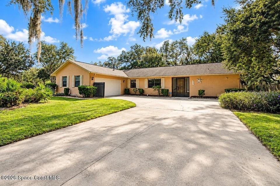 Photo of 3815 Grovewood Lane, Titusville, FL 32780 (MLS # O6450119)