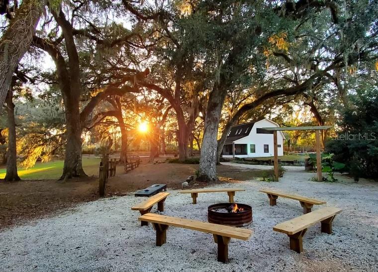 Discover Enchanted Oaks, a unique opportunity to own 2 homes , a thriving farm wedding venue, agritourism and Airbnb business on 8.30 acres in Ocala, Florida. This property offers a perfect blend of natural beauty and modern amenities, creating a magical setting for weddings and special events. Enchanted Oaks is a well-established wedding venue that has been featured on The KNOT among many other wedding event / planner sites known for its stunning oak trees, lush landscapes, and tranquil water features. The venue is fully equipped for weddings, corporate events, and private parties, while the Airbnb accommodations give a charming glamping experience. The property generates significant income through venue rentals and Airbnb bookings, making it an ideal investment. This property provides ample space for expansion, whether adding more accommodations or developing new event spaces. All necessary permits and zoning for the wedding venue are in place, ensuring a smooth transition for the new owner. There are a total of 16 different type cabins and rooms for rentals including a treehouse. 2 large homes, one is a 3/2 , the 2nd home has 2 stories, 1st floor is a 2/1 for a bridal party and the upstairs is a separate 1/1. Don't miss this rare chance to acquire a flourishing business set against one of Florida’s most enchanting landscapes. Contact us today for more information and to schedule a private tour. All booked weddings will be honored .