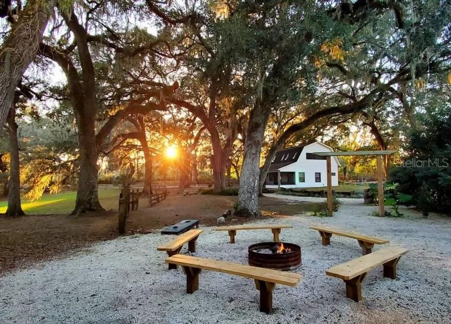 Discover Enchanted Oaks, a unique opportunity to own 2 homes , a thriving farm wedding venue, agritourism and Airbnb business on 8.30 acres in Ocala, Florida. This property offers a perfect blend of natural beauty and modern amenities, creating a magical setting for weddings and special events. Enchanted Oaks is a well-established wedding venue that has been featured on The KNOT among many other wedding event / planner sites known for its stunning oak trees, lush landscapes, and tranquil water features. The venue is fully equipped for weddings, corporate events, and private parties, while the Airbnb accommodations give a charming glamping experience. The property generates significant income through venue rentals and Airbnb bookings, making it an ideal investment. This property provides ample space for expansion, whether adding more accommodations or developing new event spaces. All necessary permits and zoning for the wedding venue are in place, ensuring a smooth transition for the new owner. There are a total of 16 different type cabins and rooms for rentals including a treehouse. 2 large homes, one is a 3/2 , the 2nd home has 2 stories, 1st floor is a 2/1 for a bridal party and the upstairs is a separate 1/1. Don't miss this rare chance to acquire a flourishing business set against one of Florida’s most enchanting landscapes. Contact us today for more information and to schedule a private tour. All booked weddings will be honored .