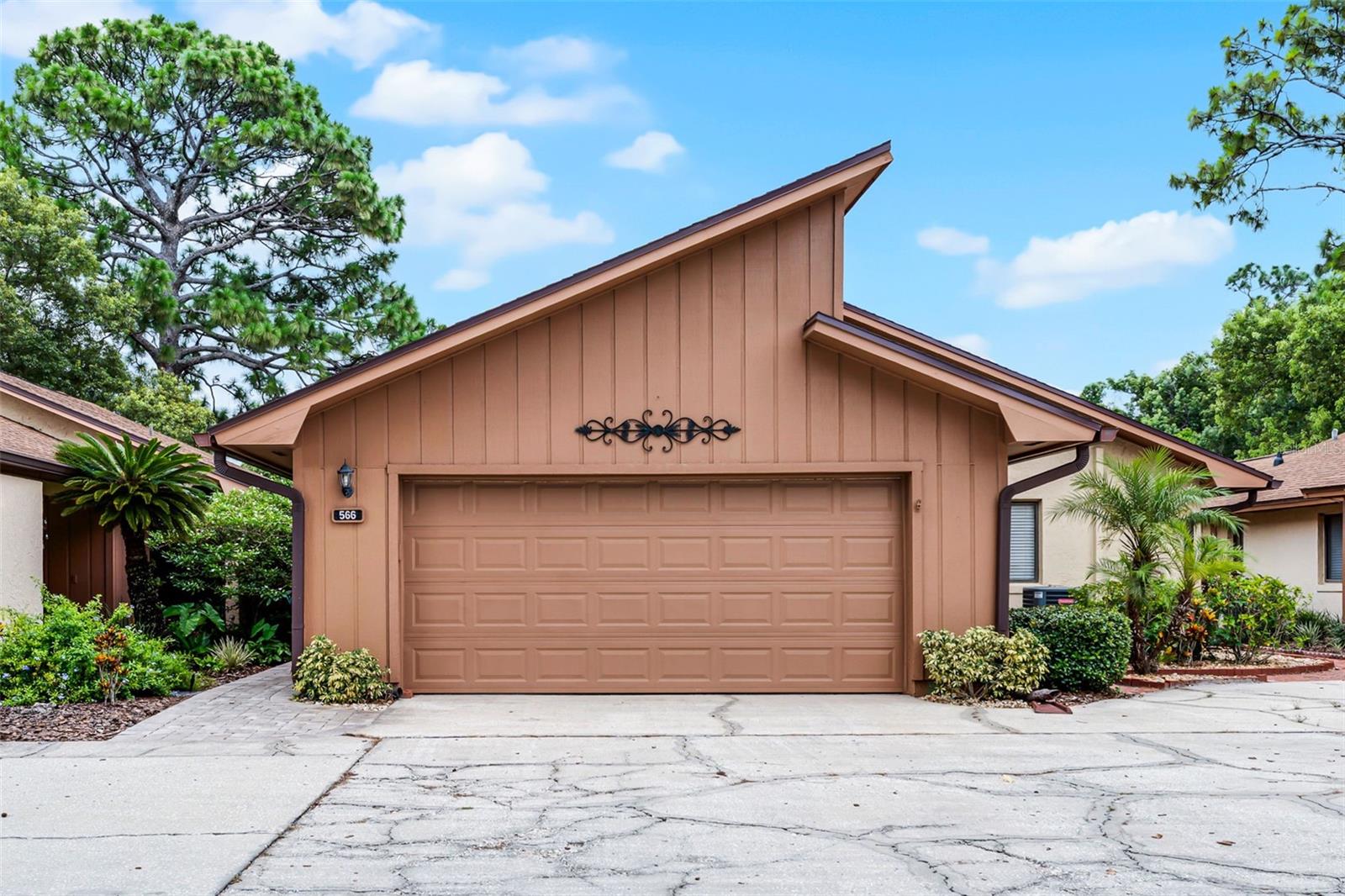 Welcome to this beautifully maintained 3-bedroom, 2-bathroom home offering the perfect blend of comfort, space, and functionality. The desirable split floorplan ensures privacy, while the open-concept layout creates a seamless flow throughout the main living areas.
Step into the spacious living room where vaulted ceilings enhance the sense of openness and natural light. Tile flooring in the main living areas provides durability and easy maintenance, while the wood flooring in the bedrooms adds a touch of warmth and elegance. The kitchen and dining areas are thoughtfully designed for both everyday living and entertaining. The large kitchen has ample countertop space for cooking and meal prep, the solid-wood cabinetry provides great storage space, and the dinette area provides the perfect spot for morning coffee or a quick meal. The primary suite is located at the back of the home and offers a walk-in closet and en-suite bathroom complete with large vanity and tile shower. Two good-size secondary bedrooms, with tons of natural lighting streaming through the large windows, share a secondary bath with single-sink vanity and shower/tub combo. Enjoy year-round relaxation in the Florida sunroom off the back of the home, with tranquil views of a large open space and no rear neighbors—a true private retreat. Additional highlights include a two-car garage, generously sized storage closets, front security door, and a new roof installed in 2022 for added peace of mind. Nestled in a quiet, peaceful neighborhood, this home offers access to a community pool and benefits from very low monthly HOA fees, which include most lawn maintenance for added convenience. Enjoy a prime location just minutes from shopping, dining, and top-rated golf courses. Whether you're looking for a comfortable primary residence or simply the ease of single-story living, this home is an ideal choice. This move-in-ready gem combines comfort and quality in a serene setting—don’t miss your opportunity to make it yours!