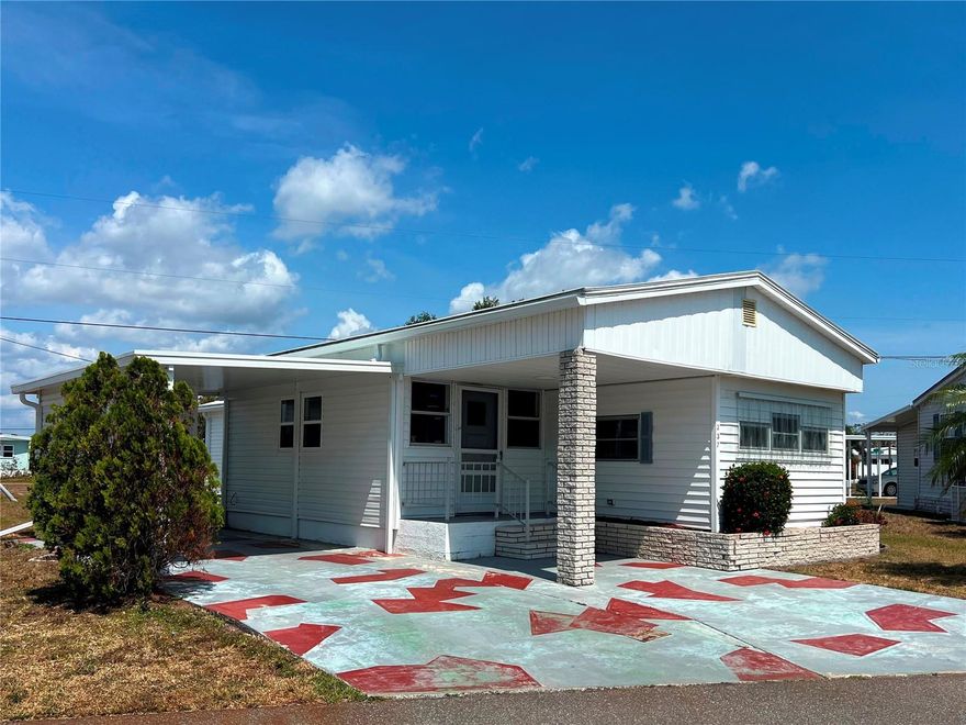 Lease fee of only $99 per year! Join this 55+ waterfront community with GULF ACCESS and enjoy abundant amenities such as a two-story clubhouse overlooking the 90-slip marina, two swimming pools, hot tub and much more. With a new AC, carport and shed installed in 2024, new gutters and hurricane protection on most windows in April 2025 plus some newer doors, windows and carpet, this is NOT your average fixer upper! With a little TLC this 2 bedroom 1.5 bath home can be that affordable Florida retreat you've been longing for. Those that like a mid-century modern vibe will dig the retro arched wooden beams in the living room with lighting and the wood built-ins in the bedrooms. The large open living area provides plenty of space for lounging and dining. A sliding door leads to a large raised concrete patio in back that could be finished off as a screened or enclosed lanai adding more square footage and living space. Harbor Cove is situated on the scenic Myakka River, the perfect place to begin your boating and fishing adventures. You can just chill out on your covered front porch at home or join in on many of the planned social activities in the community. Dances, shows, card games, trivia, shuffleboard, bocce ball, water aerobics and golf cart parades are just some of the activities available to residents. A short drive will lead to several area beaches, spring training baseball stadiums, restaurants, shopping, farmers markets and quality health care services and hospitals. Schedule a private showing to see how you can turn this affordable property into your fulltime or seasonal vacation home!