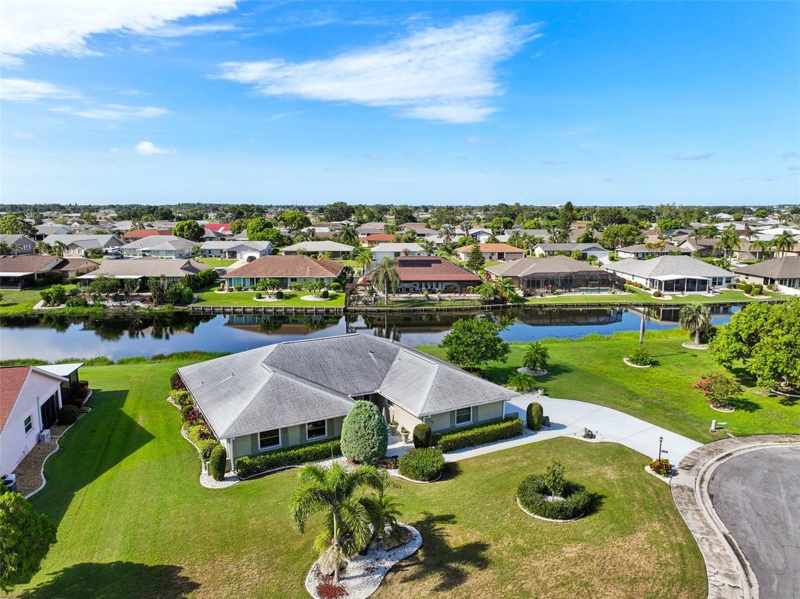 Welcome to Caloosa Country Club Estates, one of the most desirable neighborhoods in Sun City Center’s 55+ golf cart community. This spacious and beautifully maintained 3-bedroom, 2.5-bath home is situated on an oversized 0.34-acre lot with peaceful lake frontage and offers over 2,300 square feet of living space. Inside, you’ll find a bright, open layout featuring tile flooring throughout the main living areas and updated flooring in the bedrooms. The kitchen includes brand-new appliances, updated faucets, a new garbage disposal, and newly installed recessed lighting. The primary suite features a walk-in closet and a beautifully designed bathroom, while the two additional oversized bedrooms provide plenty of flexibility for guests, a home office, or hobbies.
The current owners have lived in the home for 10 years and have invested in significant improvements, including new windows ($30,000), a brand-new resurfaced and sealed driveway ($12,000), a new heat pump and furnace (2 years old, $11,000), two mini-split systems (1.5 years old, one in the bedroom and one in the 2-car garage—garage unit currently not functioning), a brand-new water softener system, high-quality ceiling fans throughout, and an advanced, high-tech water heater (1–2 years old, $3,500) installed by a top local plumber. The attic insulation has been upgraded and added to, now well above grade. The landscaping has been enhanced with $4,000 in decorative boulders. An upgraded irrigation system that draws water directly from the lake has been fully replaced with a new pump, filter, and timer—offering a significant savings on your water bill.Â
Sun City Center isn’t just a place to live—it’s a vibrant 55+ community designed for connection, convenience, and fun. With over 200 active clubs and social groups, there’s truly something for everyone—from golf, pickleball, and swimming to crafting, dancing, and lifelong learning. Residents enjoy world-class amenities like indoor and outdoor pools, a top-tier fitness center, tennis courts, performance venues, and more—all easily accessible by golf cart. Whether you're seeking an active lifestyle, new friendships, or peaceful mornings in the sunshine, Sun City Center offers it all—just minutes from Tampa, Gulf beaches, and everyday essentials. It’s low-maintenance living with high-quality amenities in a community where neighbors feel like family.