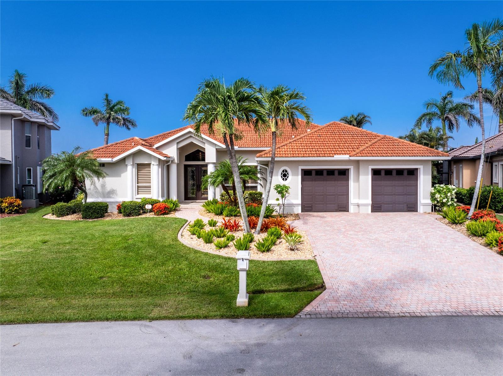 Welcome to your Florida waterfront dream home! Located in the desirable Punta Gorda Isles, this beautifully updated residence offers the perfect blend of coastal elegance and modern convenience. With 114 feet of water frontage on the main perimeter canal, this property is a boater’s paradise, featuring a 110ft concrete dock complete with TWO boat lifts, providing quick and easy access to open water. Step inside to a bright, open-concept main living area that has been thoughtfully renovated with modern finishes and stylish upgrades throughout. The spacious kitchen is a true centerpiece, boasting sleek cabinetry, high-end appliances, quartz countertops, and a large island perfect for entertaining or casual dining. High ceilings and expansive windows allow natural light to pour in, creating an airy and welcoming atmosphere. Bonus media room with bar top along with a separate room for your home office.The home’s smart layout maximizes both indoor comfort and outdoor enjoyment. Whether you’re sipping coffee on the lanai, docking your boat after a day on the water, or enjoying the pool while taking in the canal views, every moment at this property feels like a vacation. Please see the attached feature sheet highlighting all the extensive updates.