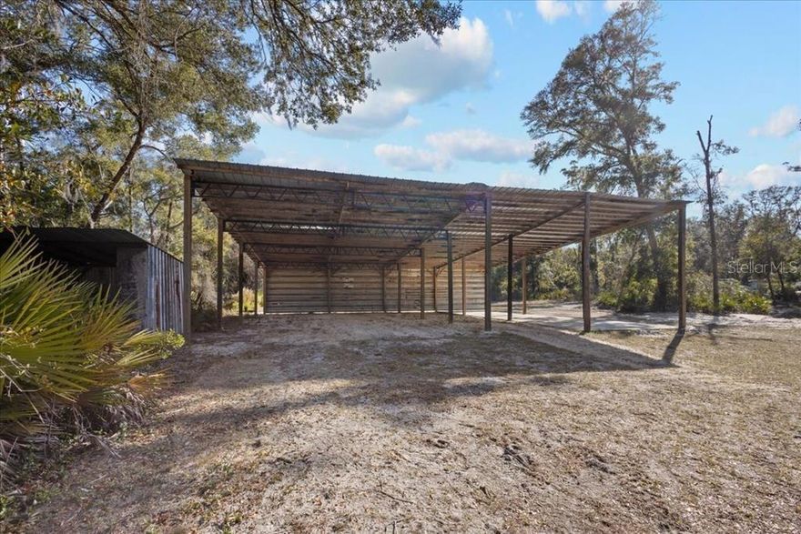 Perfect 2.49 acres located in Dixie County , minutes to some amazing freshwater fishing on the Suwannee River and a short drive to the Gulf of Mexico. This property has a massive 50x50 pole barn with additional metal trusses added, one bay has a concrete flood. A pump shed and a 200amp panel power pole (not active), well and septic tank (last used approx 2012) , all items are staked on the property. This property is ready to go with some recent lane clearing and additional property clearing but offering a wonderful tree buffer to keep this lot nice and private. Perfect for manufactured homes, site built homes, NO HOA and NO restrictions! Call today for YOUR tour! This gem will NOT last long!