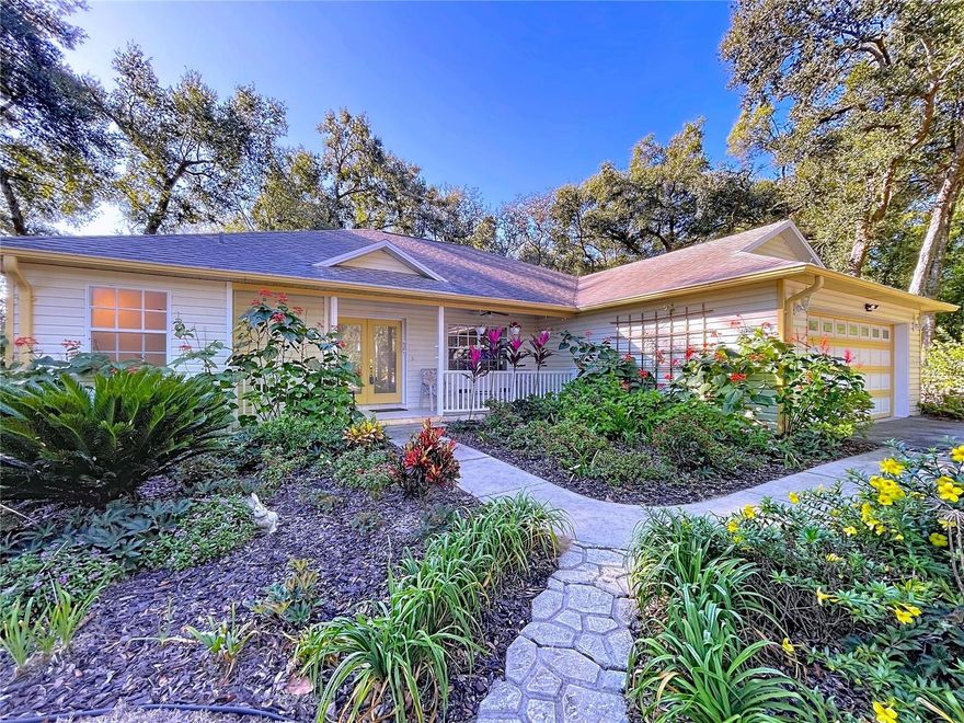 HOME WITH ATTACHED GUEST HOUSE & RV PARKING!!! Here’s your OPPORTUNITY to own this one of a kind 3/2/2 Home on OVER an ACRE with an Attached INLAW/GUEST Home with Full Bedroom, Full Bath, Full Living Room, and a Full Kitchen.  If you have an RV or if you have friends or family who come to visit with an RV this property can accommodate your needs. The RV Port has full electric service with a Convenient Storage Shed out back. The Main Home has 1765 Sq. Ft. with an Open Great Room Floor Plan. The Guest House has 828 Sq. Ft., Or you can open the 2 areas up and have 2593 Sq. Ft. The Main House has 3 bedrooms, 2 baths, a full Laundry Room, Kitchen, Covered Lanai and a 2 car Garage.  There is a HUGE Paver Patio that services both the Main Home and the Guest House and the property has Plum, Avocado, Orange, Mango, Starfruit and Loquat Trees and Butterfly Gardens with Breathtaking Flowering Plants.  There is an irrigation system to keep everything watered. There’s also a fire pit for cozy fall evenings. The Versatile Guest House/Apartment/In-Law Quarters has it's own private entry and is fully functional with it’s own AC system.  The Guest House has a patio, a full bedroom, a bathroom with a walk in shower, dining area, kitchen and spacious living room. The Lot is 1.63 acres zoned AR (Agricultural Residential).  Easy access to US 301 – Dade City for shopping, dining & medical. These types of properties don’t come on the market very often so schedule your viewing today!