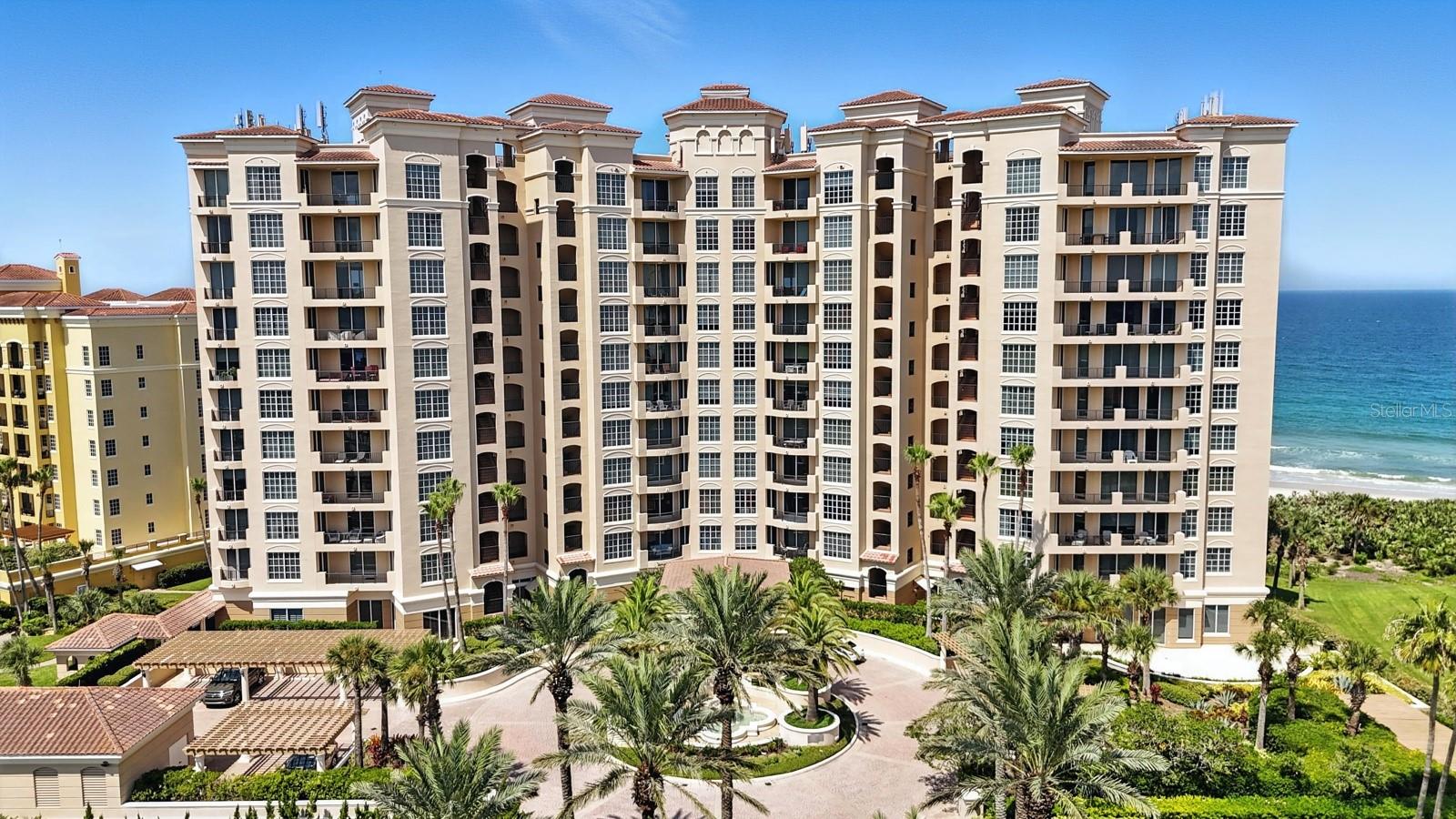 Experience luxury coastal living at its finest in this exquisite 3-bedroom, 3-bath residence perched on the 8th floor of the prestigious Portofino Condominium in Hammock Dunes. With sweeping ocean vistas to the east and serene golf course views to the west, this rare offering provides a stunning panorama from sunrise to sunset. Thoughtfully designed for both comfort and sophistication, this spacious unit features an open-concept layout, soaring ceilings, and floor-to-ceiling windows that flood the space with natural light. The gourmet kitchen is appointed with premium appliances, granite countertops, and custom cabinetry—perfect for entertaining or enjoying a quiet evening at home. The primary suite is a true retreat, complete with ocean views, a spa-inspired bath, and generous walk-in closets. Each guest suite offers privacy and luxury, with en-suite baths and ample storage. Portofino is one of Hammock Dunes' premier oceanfront condominiums, offering resort-style amenities including a private beach access, oceanfront pool, fitness center, social rooms, and 24-hour security. Optional membership to the Hammock Dunes Club adds access to two Audubon-certified golf courses, fine dining, tennis, and more. Whether you're seeking a full-time residence or a refined coastal escape, this exceptional condo delivers unparalleled elegance and lifestyle.