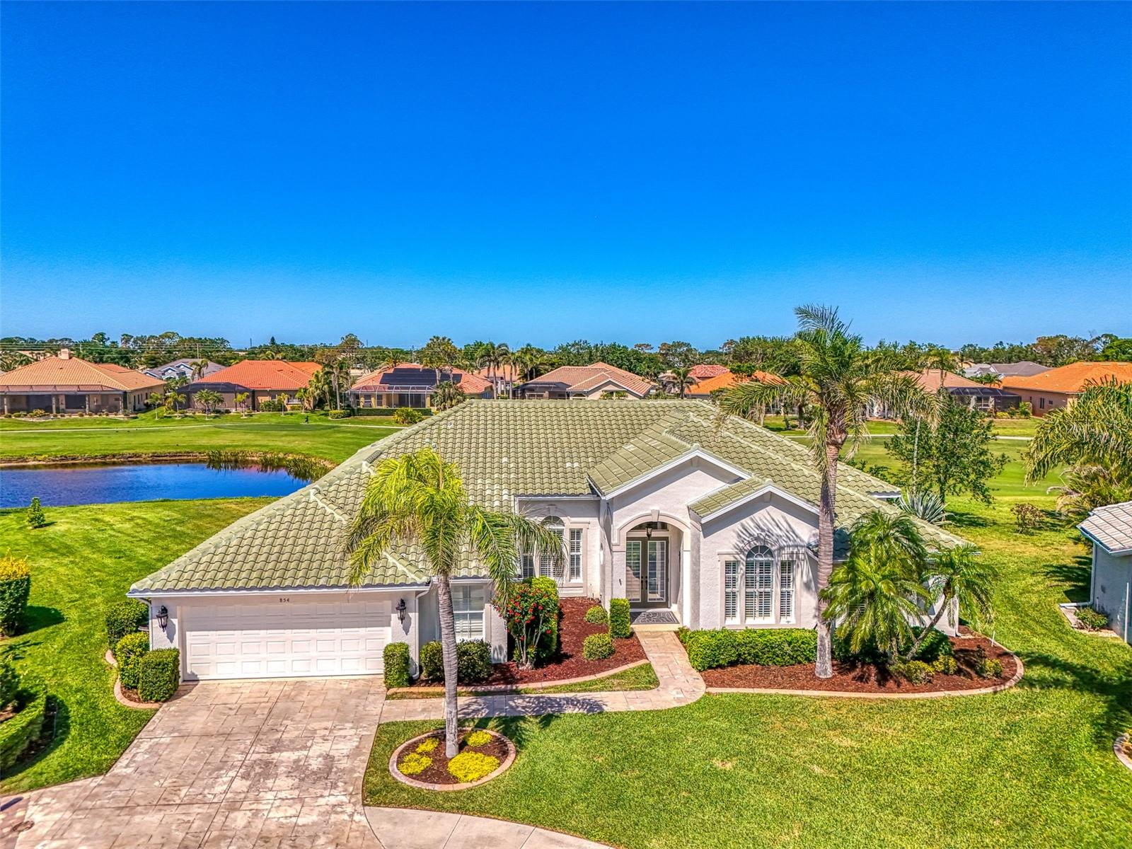 This absolutely gorgeous Arthur Rutenberg home is nestled on a culdesac street in the highly sought after Pelican Pointe Golf and Country Club community. From the moment you enter this beautiful home you will see the stunning open concept layout with its high high volume ceilings. this home has been completely remodeled with elegant touches thru-out , the home shows like a model with the beautiful porcelain floors . As you enter you will see the formal living room along with a formal dining room. Walk thru to the stunning gourmet kitchen that looks over the family room. The kitchen has granite counter tops, an island with a built in cook top, and stainless steel appliances. Off the kitchen is the laundry room and a flex room for added storage. The family room looks out onto the pool and the golf course . The split floor plan has two bedrooms that share a full bath along with a third bedroom with a private bath . Off of the living room you will find a very nice den and also the primary bedroom suite which includes an ensuite . The primary bath has a shower along with a soaker tub and double vanity. This home is a true show stopper and is ready for the new family with nothing left to do. Pelican Pointe is one of Venice premier communities with a beautiful club house and restaurant.
