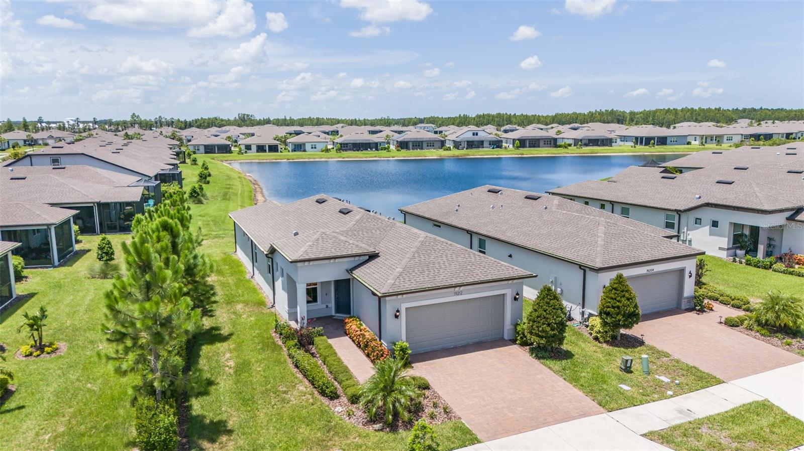 Serene, Move-In Ready Home in Gated Del Webb Bexley – Spacious Lot with Pond Views!
Tucked within the prestigious 55+ gated enclave of Del Webb Bexley, this beautifully maintained 2-bedroom + Flex Room, 2-bathroom home offers a rare combination of privacy, scenic views, and modern comfort—all in a vibrant, resort-style community.
Set on a tranquil cul-de-sac with breathtaking pond views, this residence is framed by mature landscaping and a lush hedge that provides a peaceful natural buffer. Thoughtfully maintained, the home features rain gutters that extend around the entire perimeter, offering added protection and ease of upkeep. Step inside to an open-concept floorplan filled with natural light, where the heart of the home, the spacious kitchen, shines with 42-inch cabinetry, granite countertops, stainless steel appliances, custom hardware, pull-out shelving, and a large center island with breakfast bar and pendant lighting.
The living and dining areas flow effortlessly into a screened lanai with a privacy wall, pre-plumbed for a wet bar and beverage center. The primary suite offers tranquil water views and a thoughtfully designed ensuite bath with dual sinks, a walk-in shower with bench seating, a linen closet, and a generous walk-in closet.
A well-appointed guest bedroom and full bath ensure comfort for visitors, while the versatile Flex Room easily serves as an office, hobby space, or guest retreat. Throughout, every detail reflects thoughtful design and meticulous care.
Enjoy the peace of mind that comes with maintenance-free lawn care and the perks of a community known for its exceptional amenities—including scenic trails, dog parks, state-of-the-art fitness facilities, multiple pools, and a 19,000 sq. ft. clubhouse with a bistro café and over 45 clubs and activities.
Whether you're seeking a full-time residence or a seasonal retreat, this Del Webb Bexley gem delivers style, serenity, and community. Schedule your private tour today.