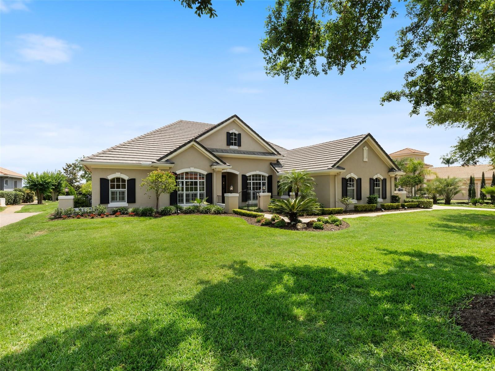 CASUAL ELEGANCE abounds in this well appointed home, with one of the BEST VIEWS, Nestled in the Rolling hills of East Pasco's Gated community of Lake Jovita Golf and Country Club! Tastefully remodeled & decorated, this Arthur Rutenberg home offers LUXURY living at its finest. Barely used, only occupied for a few months each year, this home has been meticulously maintained & features a host of custom upgrades totaling over $80,000. With picturesque views of the fairway of hole #16 on the North Course and charming St. Leo, you'll enjoy the calming sound of bells chiming, creating a serene atmosphere, right in your own backyard! Boasting 3,105 SF of living space, this home includes 3 bedrooms, PLUS a den/office, PLUS a bonus room and 3 full baths. The 3-car side-entry garage, with painted floor, provides ample space for parking and storage. The beautifully designed outdoor area includes a heated pool with a spill-over spa, complete with a newly replaced variable speed pool pump, a 333 BTU pool heater & upgraded rotating color pool lights, ensuring a luxurious and relaxing outdoor living experience. Hilltop breezes and Serene views of St Leo in the distance as you relax or entertain on your extended lanai. Great Curb Appeal with $20,000 in landscaping, solar lights and Gated Courtyard entry! Inside, you'll find a wide array of impressive features, including professionally painted wood maple cabinets in the kitchen, complemented by granite countertops, crown molding, and a stainless undermount sink. The home has been meticulously updated with engineered wood floors in bedrooms and bonus room, with hardwood flooring in the den/office. Walk-in pantry with wooden shelves and leaded glass door adds to the elegance of the home. The interior has been painted neutral for a light, bright feel and the Exterior freshly painted in 2025 for a Stately appeal. Additional upgrades such as tray ceilings, remote-controlled vertiglide window shades, upgraded ceiling fans, light fixtures and plantation shutters make this home elegant and efficient. The property also features an irrigation well for sprinklers, a $8,000 investment, ensuring lush greenery year-round, and a recent roof cleaning with newly added gutters. The brick paver entry and paver pool deck were resanded and resealed in 2025, enhancing the home’s curb appeal, making it a true standout. The leaded glass front entry door with sidelights, along with the home's niches, arches, and eyebrow windows, add architectural charm and timeless elegance. Owners retreat is privately positioned on the opposite side of the home from the secondary bedrooms and bonus room with GREAT ROOM in the center as the Hub of the home. Open to the kitchen with sliding window wall to extend your entertaining space. This home is truly a rare find, offering a combination of luxurious upgrades, tranquil surroundings and STUNNING views on .62 acre lot. Low quarterly HOA includes park, playground, tennis, pickleball & basketball courts, walking trail with exercise stations, dog parks & open fields. Enjoy the Country Club lifestyle with optional memberships for Tennis, 2 Championship Golf courses, Jr Olympic Pool, Fitness center, Pro shop, Social activities, onsite Restaurant & pub/grille. Located just North of Tampa with easy access to major highways to Orlando, Ocala, Lakeland, Airports and the Beaches! Don’t miss your chance to own this exceptional property in Lake Jovita’s exclusive Golf and Country Club community. CALL today!
