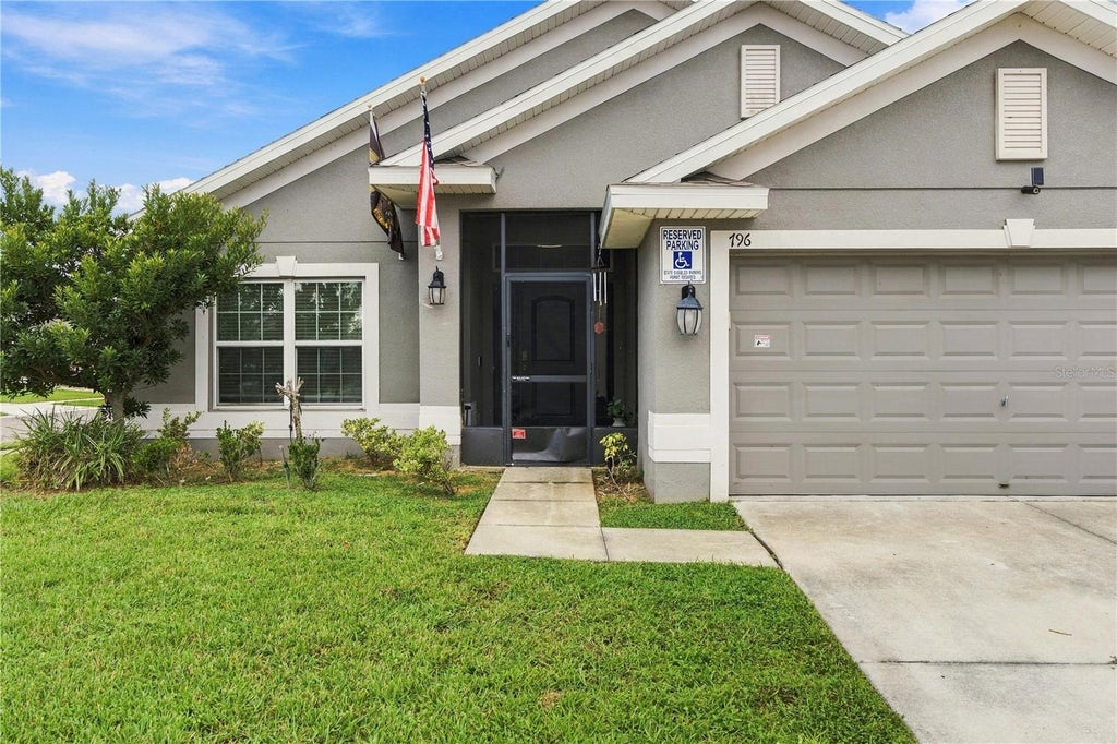Photo of 796 Meadow Pointe Drive, Haines City, FL 33844 (MLS # O6447134)