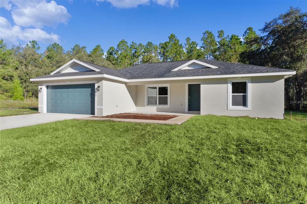 Photo of 21 Malauka Pass Trail, Ocklawaha, FL 32179 (MLS # G5103398)