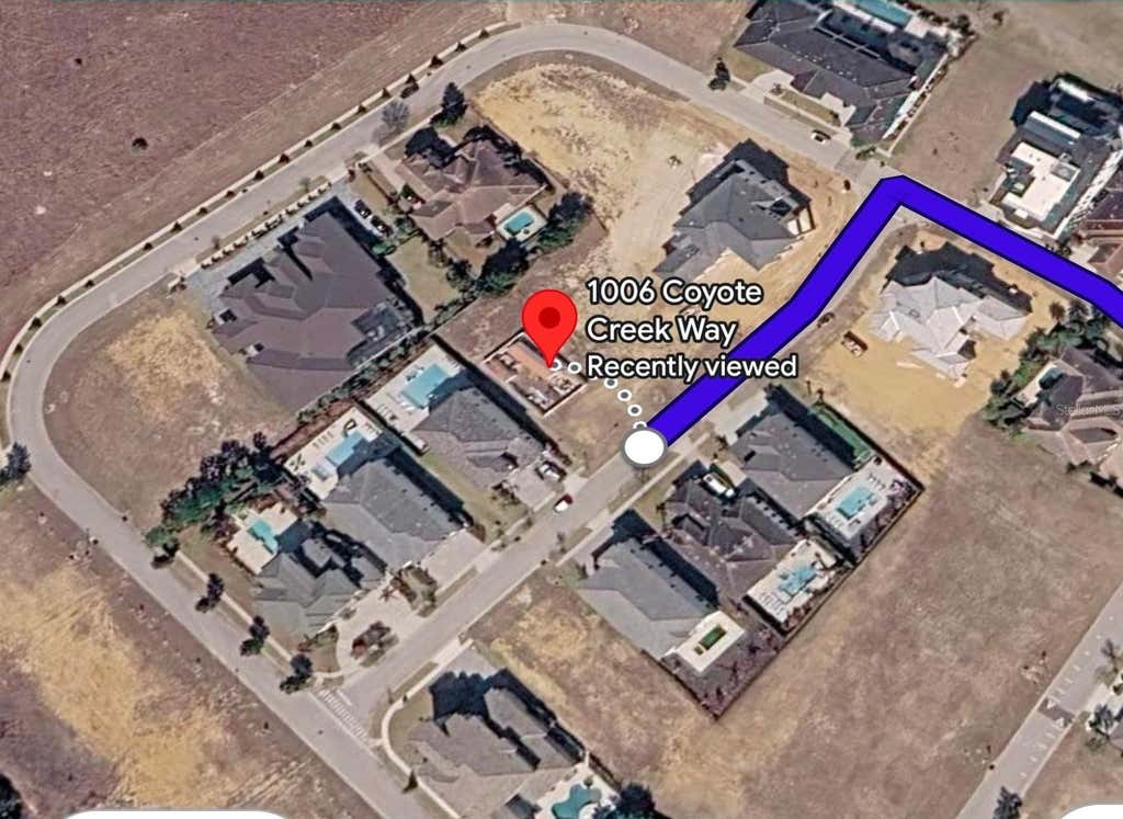 Photo of 1006 Coyote Creek Way, Kissimmee, FL 34747 (MLS # O6432242)